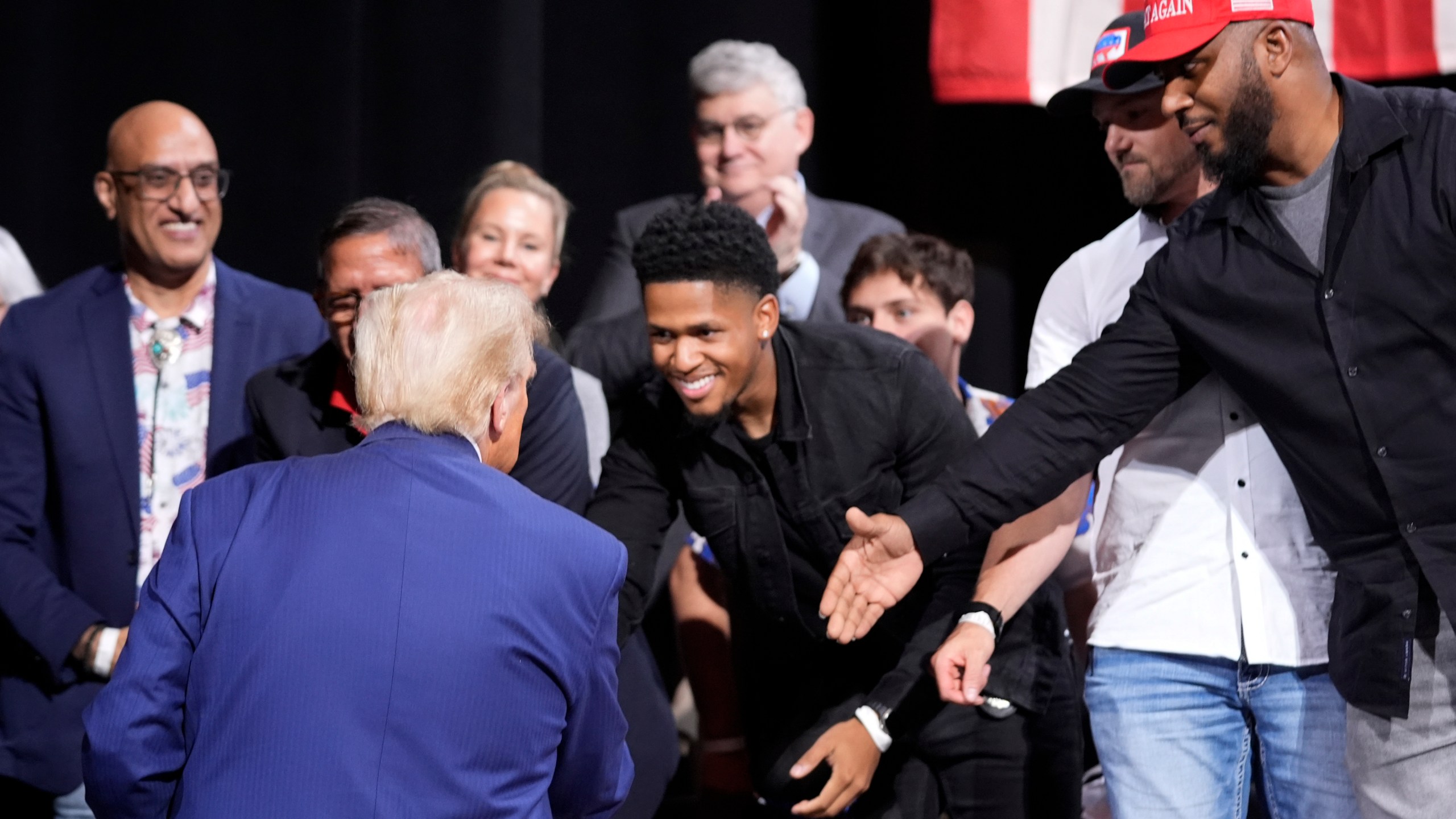 Republican presidential nominee former President Donald Trump greets supporters at a campaign event at the Cobb Energy Performing Arts Centre, Tuesday, Oct. 15, 2024, in Atlanta. (AP Photo/Alex Brandon)