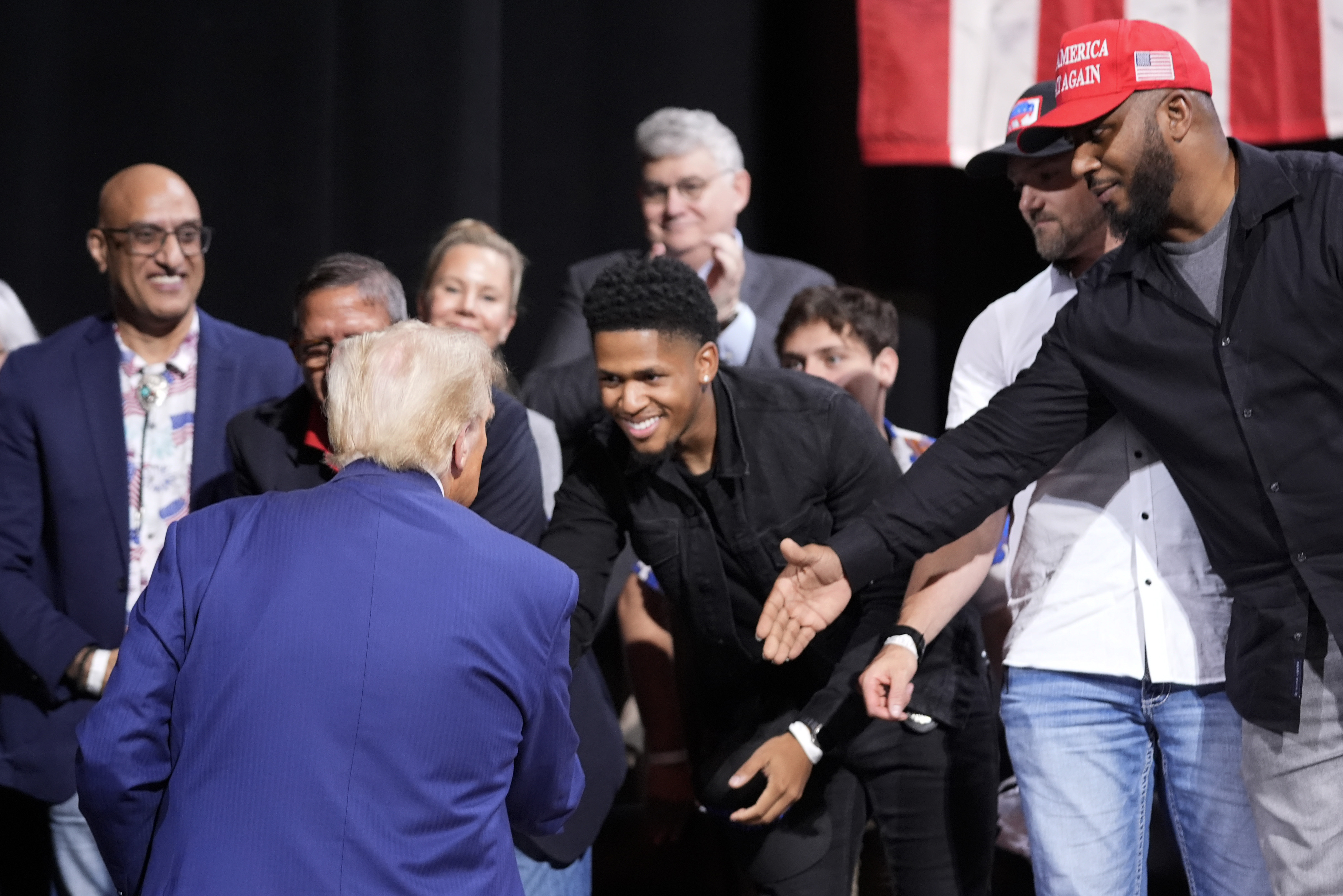 Republican presidential nominee former President Donald Trump greets supporters at a campaign event at the Cobb Energy Performing Arts Centre, Tuesday, Oct. 15, 2024, in Atlanta. (AP Photo/Alex Brandon)