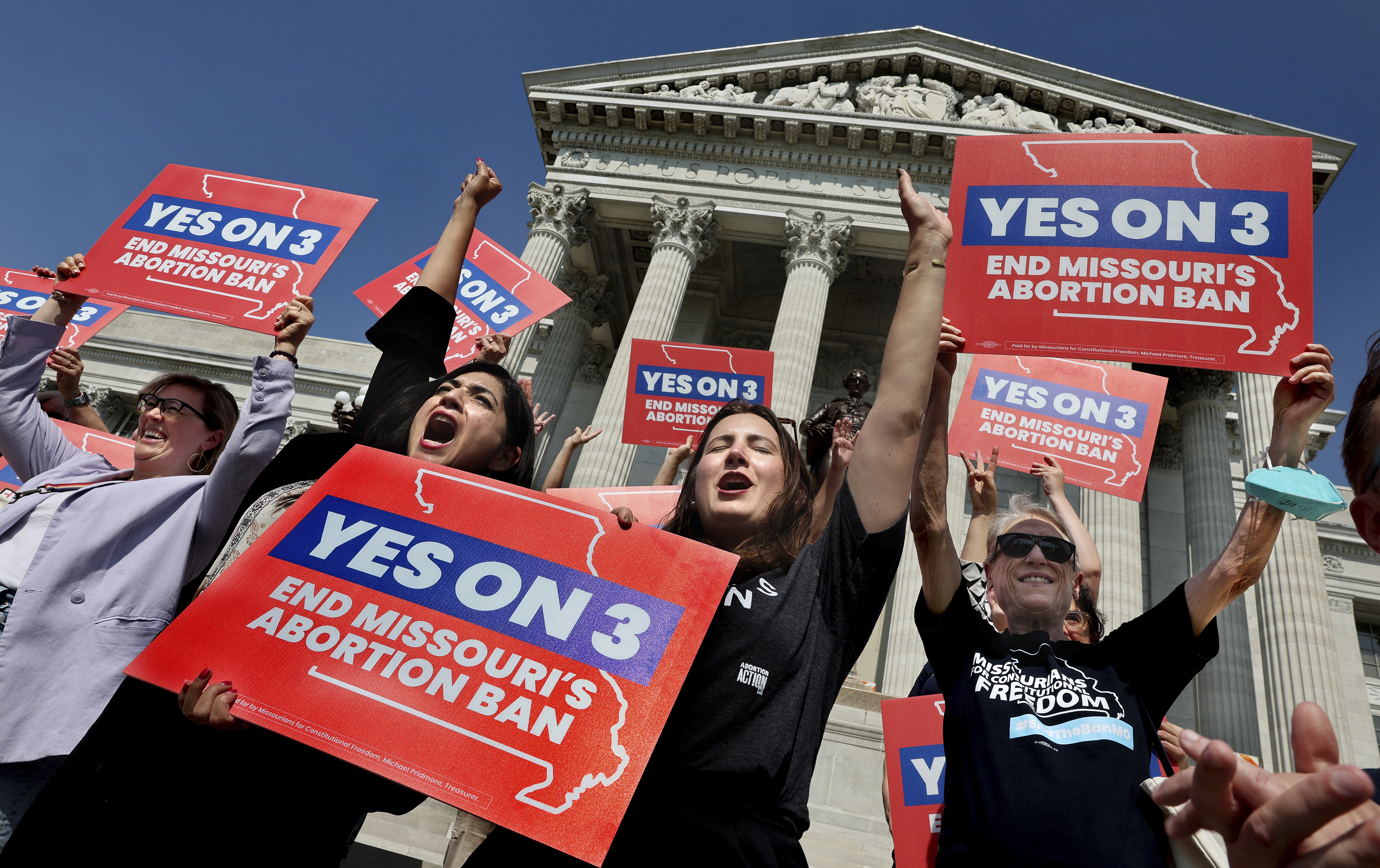 FILE - Amendment 3 supporters Luz Maria Henriquez, second from left, executive director of the ACLU Missouri, celebrates with Mallory Schwarz, center, of Abortion Action Missouri, after the Missouri Supreme Court in Jefferson City, Mo., ruled that the amendment to protect abortion rights would stay on the November ballot in on Tuesday, Sept. 10, 2024. (Robert Cohen/St. Louis Post-Dispatch via AP, File)