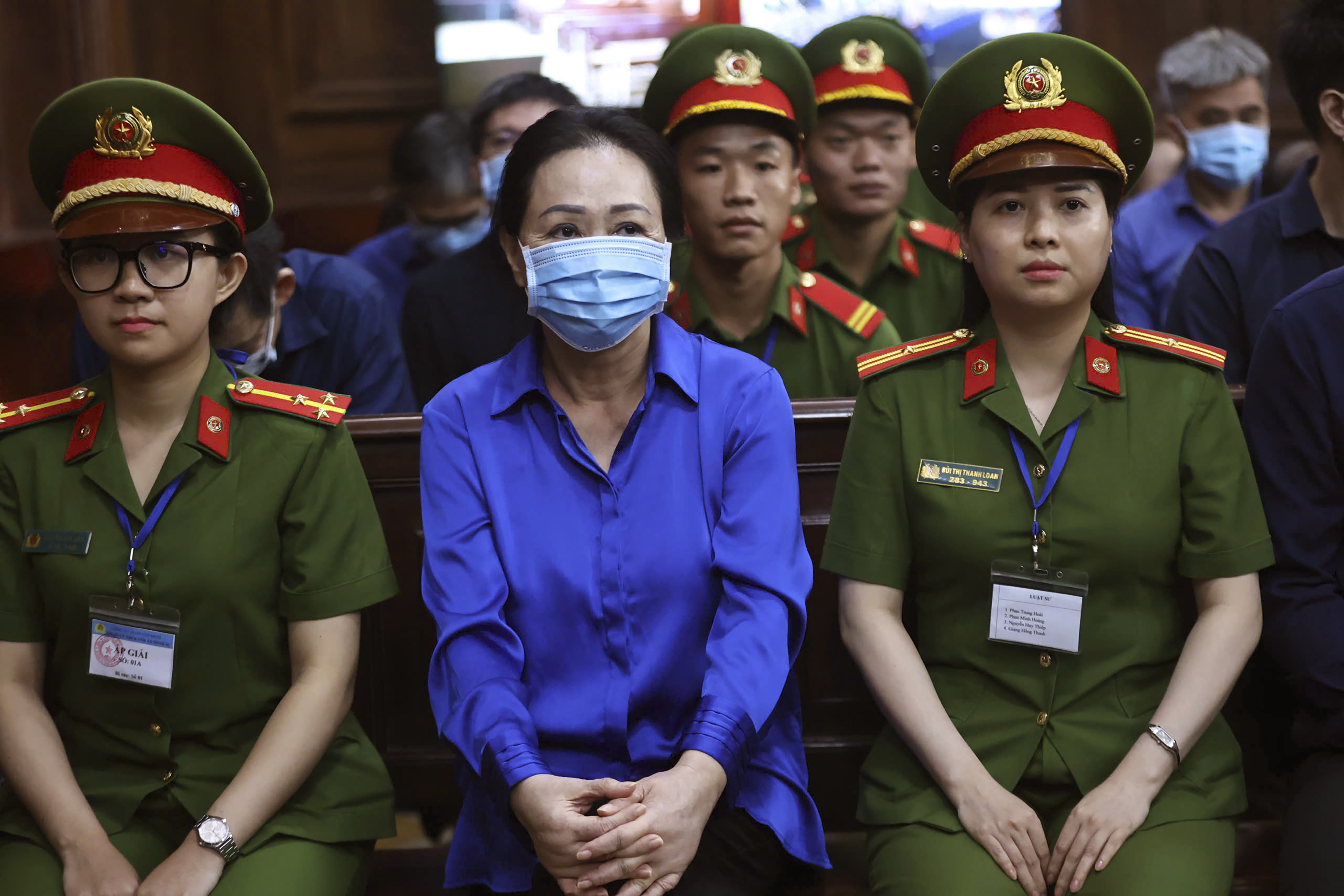 Vietnamese real estate tycoon Truong My Lan, center, sits in court to wait for her verdict on fraud, money laundering and illegal cross-border money transferring in Ho Chi Minh city, Vietnam Thursday, Oct. 17, 2024. (Quynh Tran/VnExpress via AP)