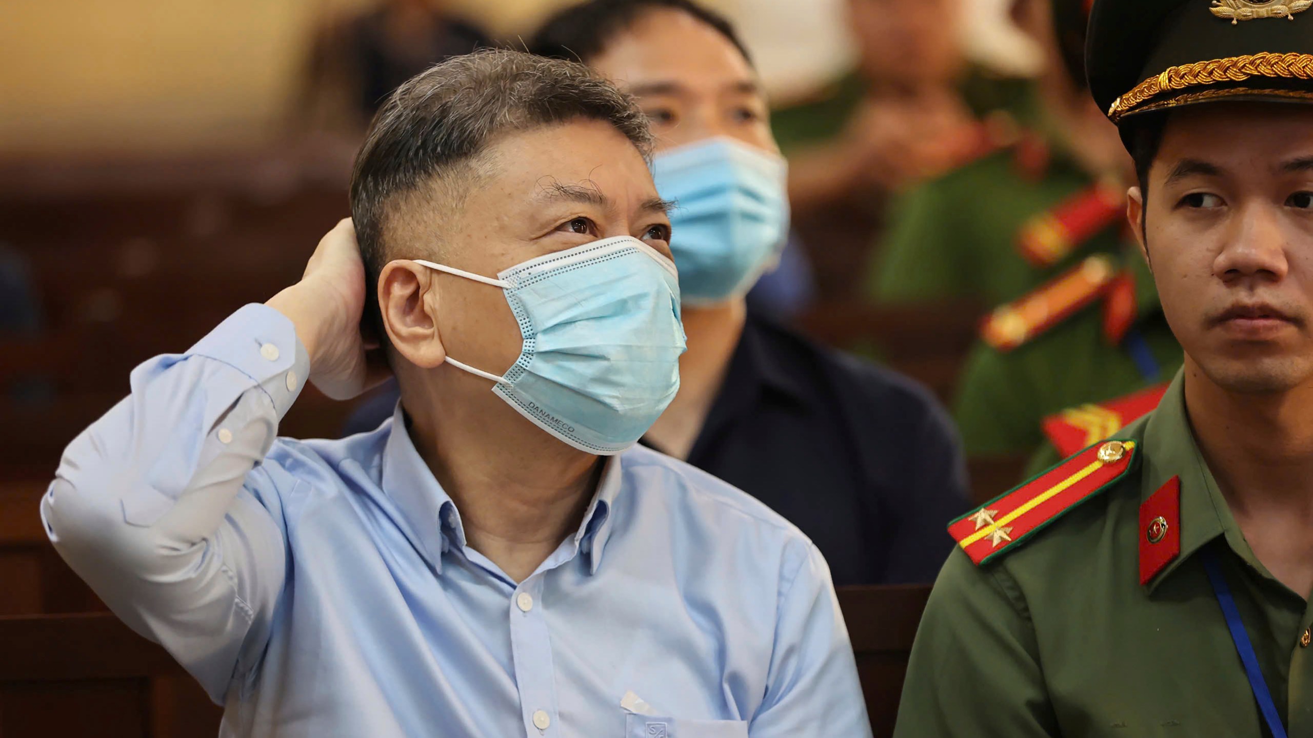 Chu Nap Kee, husband of Vietnamese real estate tycoon Truong My Lan, sits in court to wait for her verdict for his involvement in Lan's case in Ho Chi Minh city, Vietnam Thursday, Oct. 17, 2024. (Quynh Tran/VnExpress via AP)