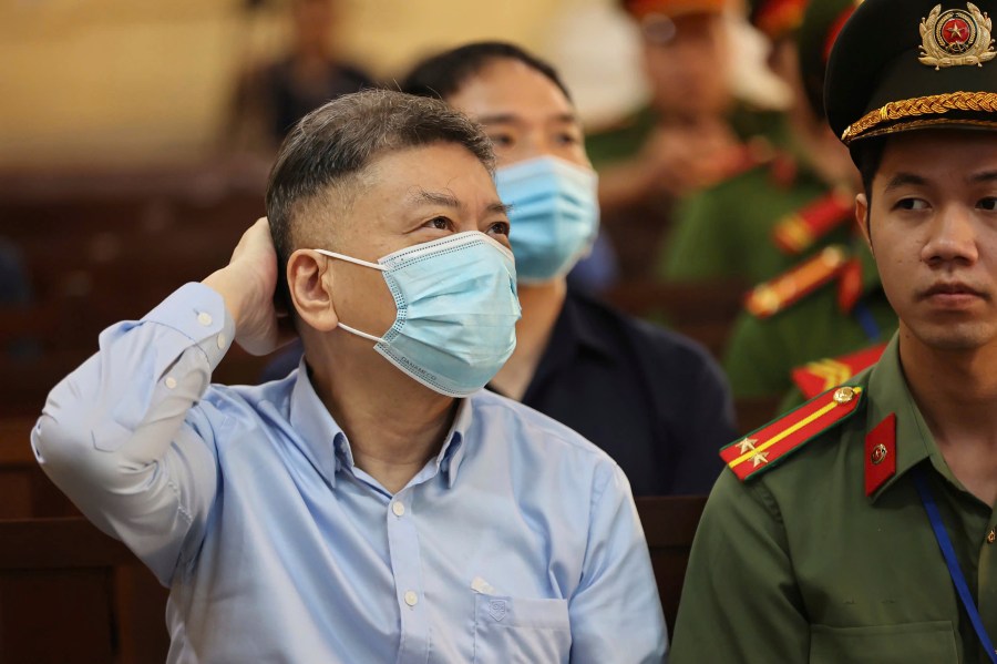 Chu Nap Kee, husband of Vietnamese real estate tycoon Truong My Lan, sits in court to wait for her verdict for his involvement in Lan's case in Ho Chi Minh city, Vietnam Thursday, Oct. 17, 2024. (Quynh Tran/VnExpress via AP)