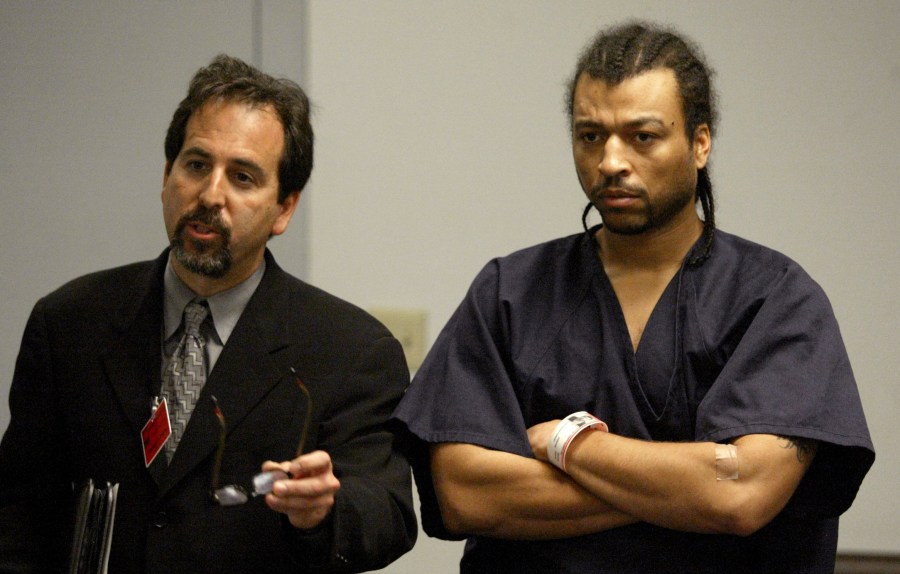 FILE - Lawyer Drew Findling, left, speaks before the bench alongside Demetrius "Big Meech" Flenory, right, during his first court appearance, Jan. 12, 2003, at the Fulton County Jail in Atlanta. (John Spink/Atlanta Journal-Constitution via AP)