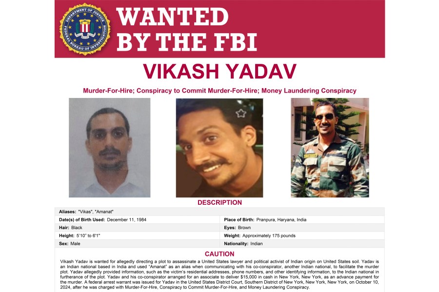 This wanted poster provided by the FBI shows Vikash Yadav, an Indian government employee, wanted on criminal charges in connection with a foiled plot to kill a U.S. citizen in New York City. (FBI via AP)