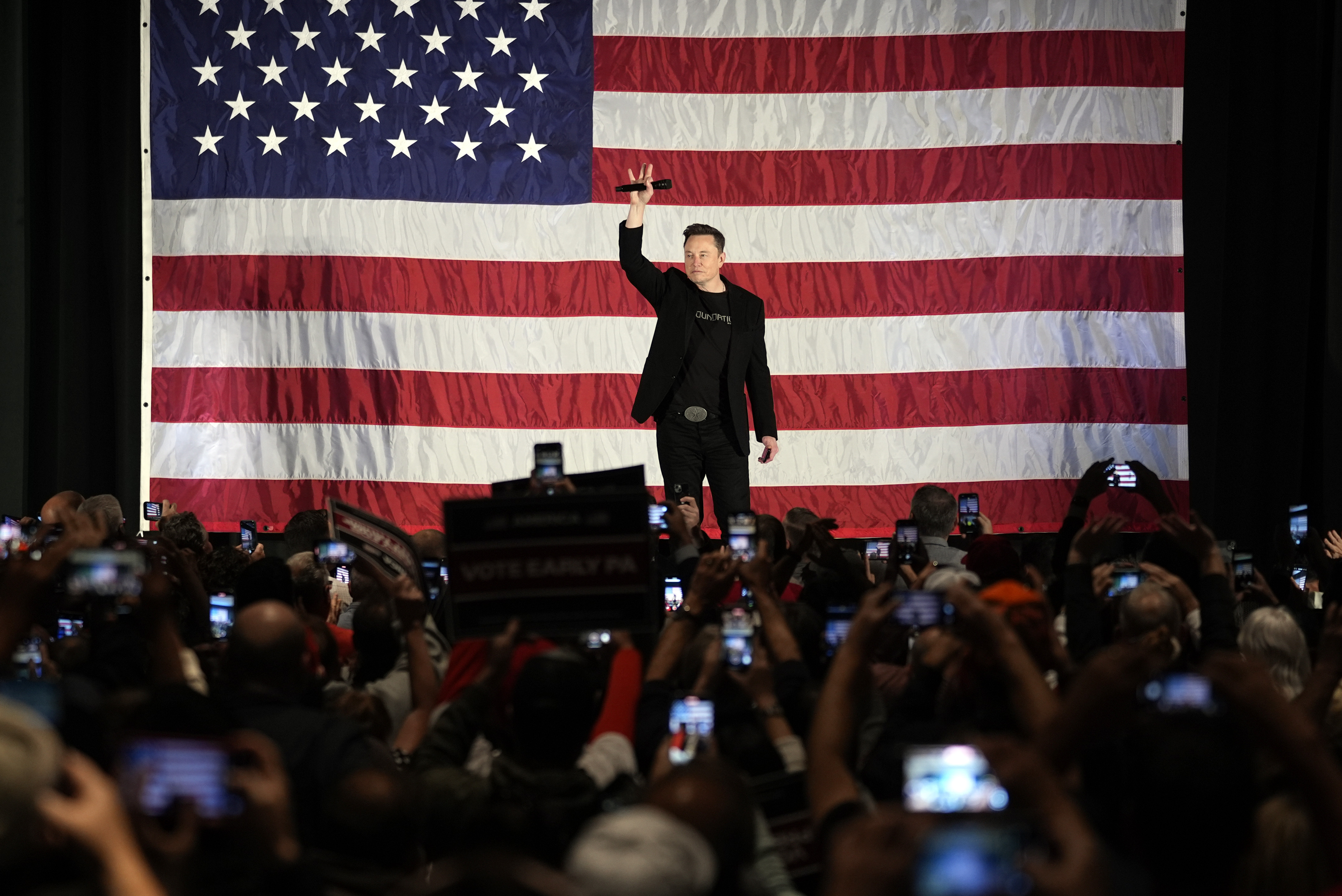 Elon Musk speaks as part of a campaign town hall in support of Republican presidential nominee former President Donald Trump in Folsom, Pa., Thursday, Oct. 17, 2024. (AP Photo/Matt Rourke)