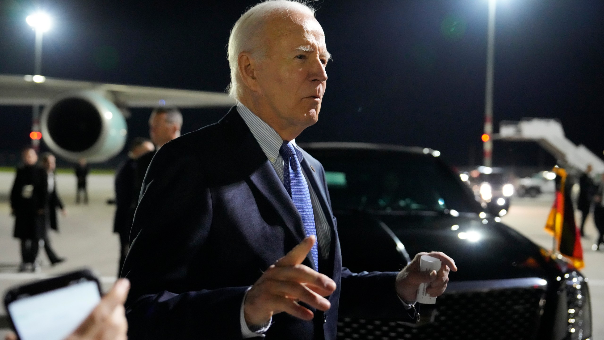 President Joe Biden gestures as he speaks after arriving at Brandenburg Airport in Schoenefeld near Berlin, Germany, Thursday, Oct. 17, 2024. (AP Photo/Ben Curtis)