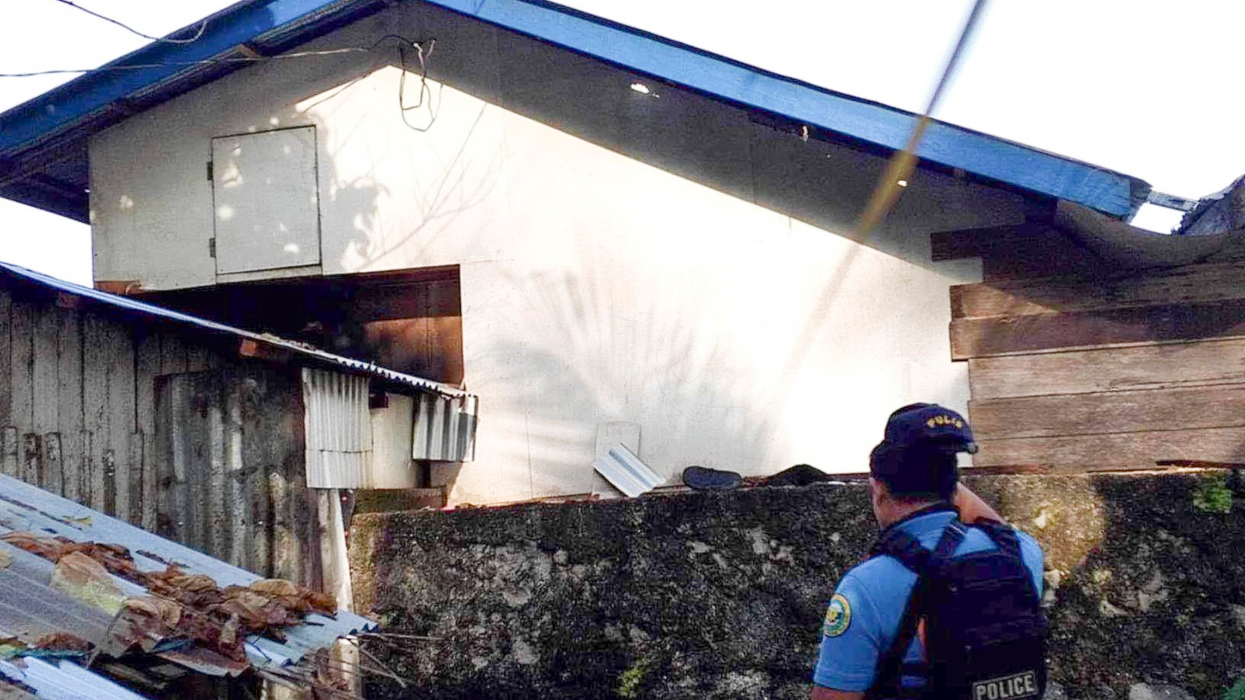 In this photo provided by the Philippine National Police Regional Office 9, a policeman checks an area Friday Oct. 18, 2024, where an American identified as Elliot Onil Eastman, from Vermont, was reportedly abducted by gunmen in Sibuco town, Zamboanga del Norte province, southern Philippines. (Philippine National Police Regional Office 9 via AP)