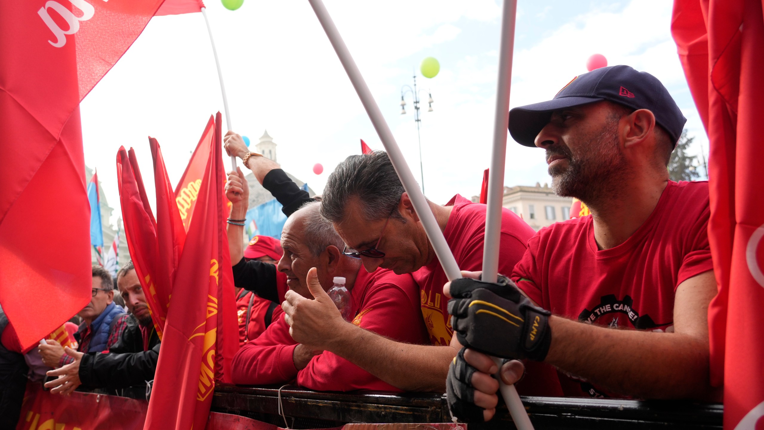 Workers of automotive sector gather in Rome's Piazza del Popolo Square during a demonstration on the occasion of their national strike, Friday, Oct. 18, 2024. (AP Photo/Gregorio Borgia)