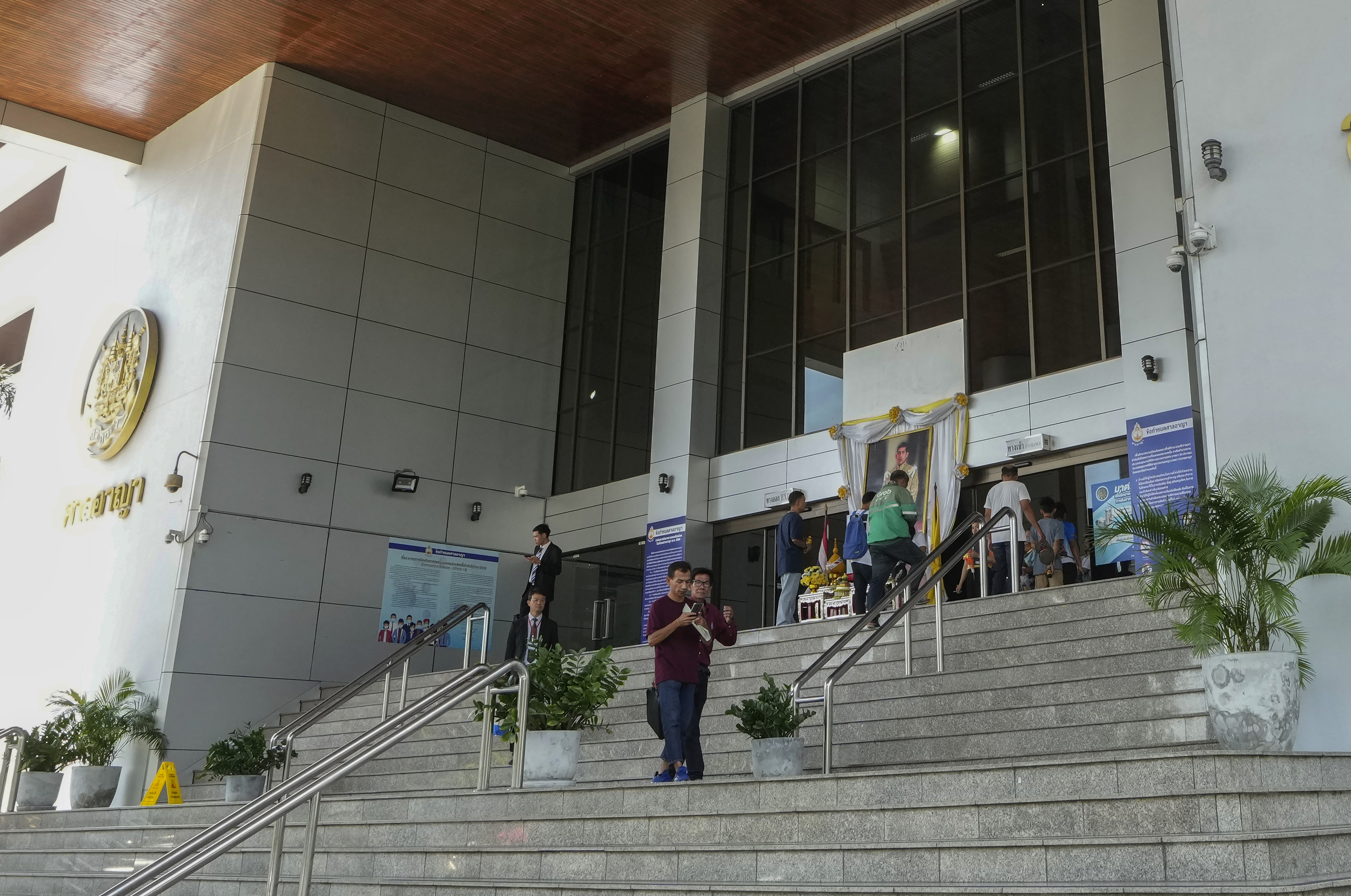 FILE - Peoples leave the Bangkok Criminal Court in Bangkok, Thailand, on Sept. 30, 2024. (AP Photo/Sakchai Lalit, File)