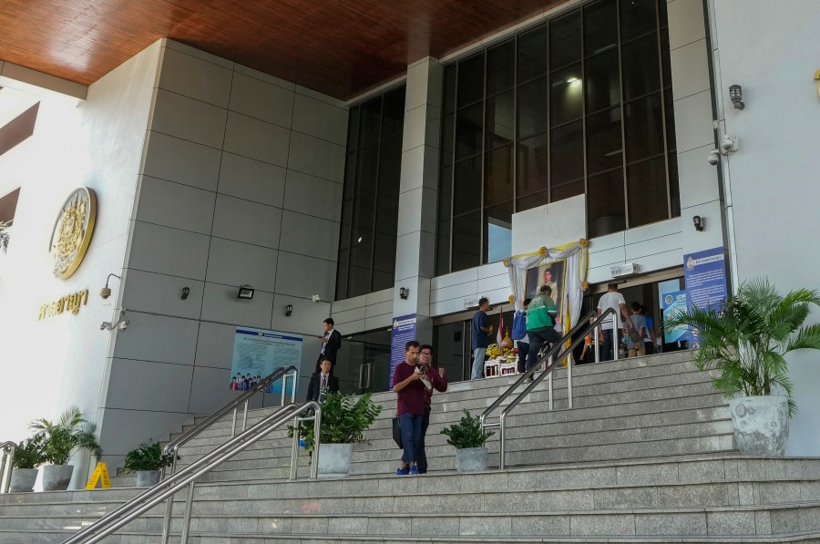 FILE - Peoples leave the Bangkok Criminal Court in Bangkok, Thailand, on Sept. 30, 2024. (AP Photo/Sakchai Lalit, File)