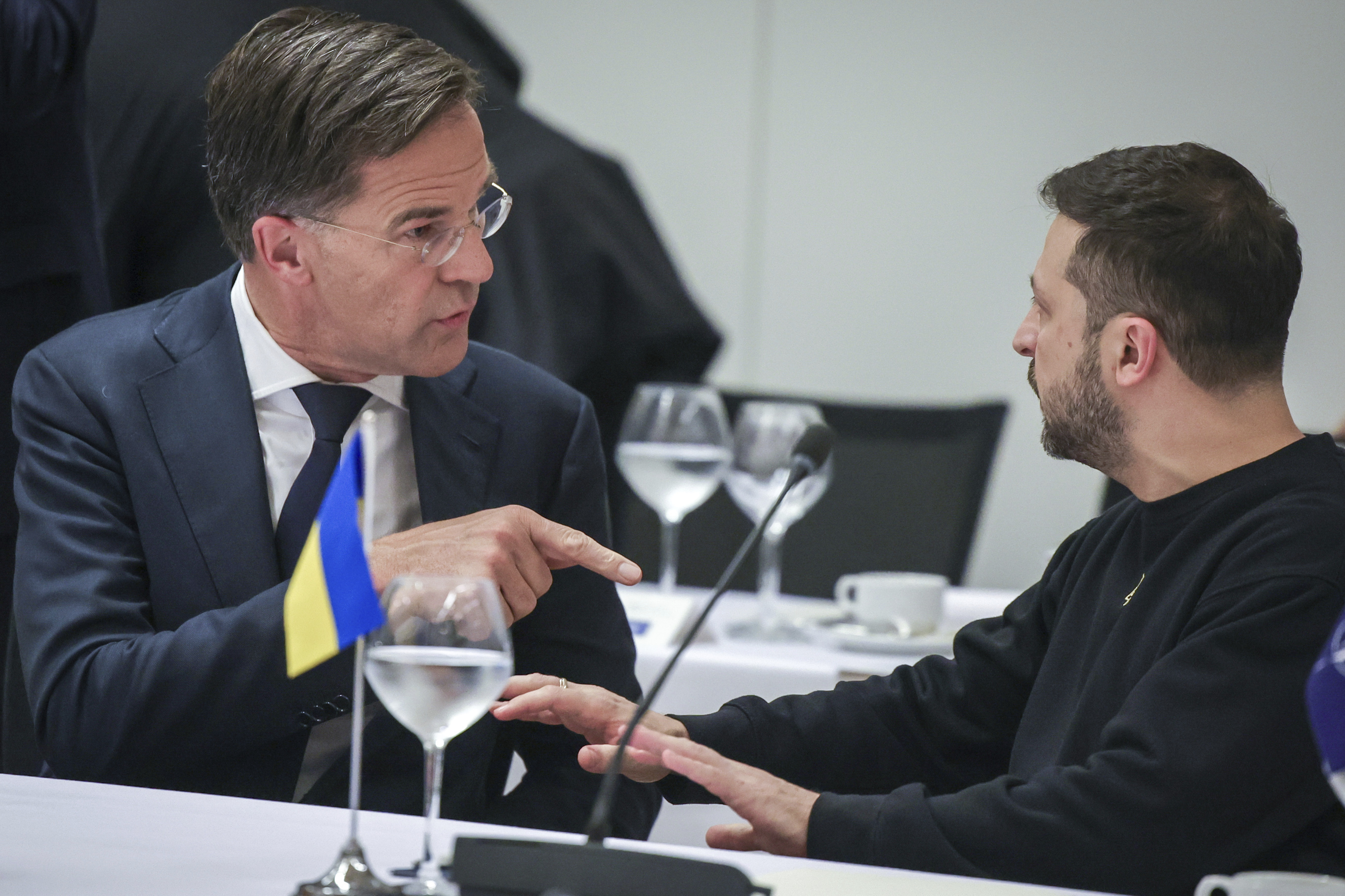 NATO Secretary General Mark Rutte, left, speaks with Ukraine's President Volodymyr Zelenskyy during the NATO-Ukraine Council working dinner at NATO Headquarters in Brussels, Thursday, Oct. 17, 2024. (Olivier Matthys, Pool Photo via AP)