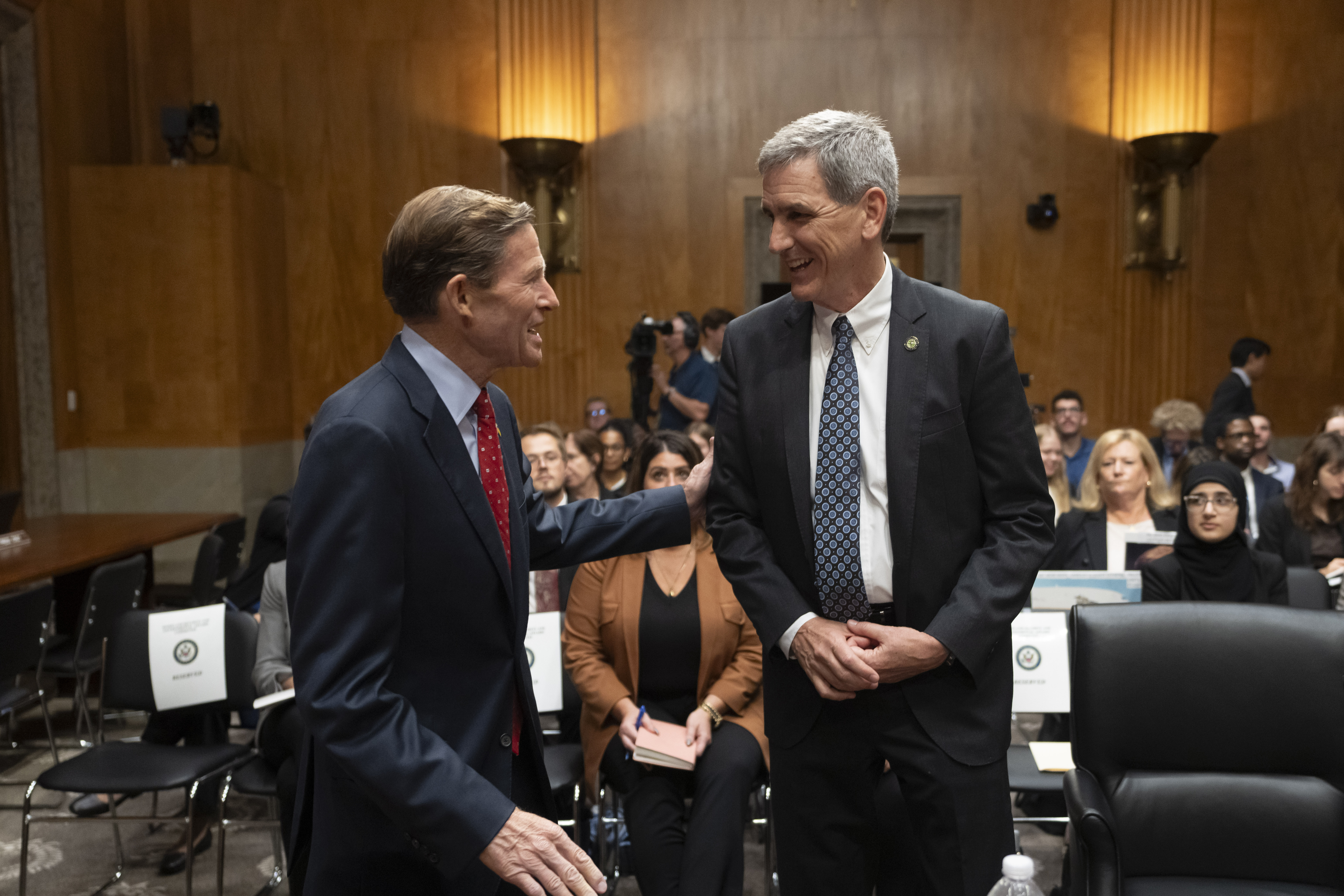 Federal Aviation Administration (FAA) Administrator Mike Whitaker, right, is greeted by Sen. Richard Blumenthal, D-Conn., left, before testifying at a Senate Committee on Homeland Security and Governmental Affairs, Subcommittee on Investigations, hearing on the FAA's oversight of Boeing, on Capitol Hill in Washington, Wednesday, Sept. 25, 2024. (AP Photo/Ben Curtis)