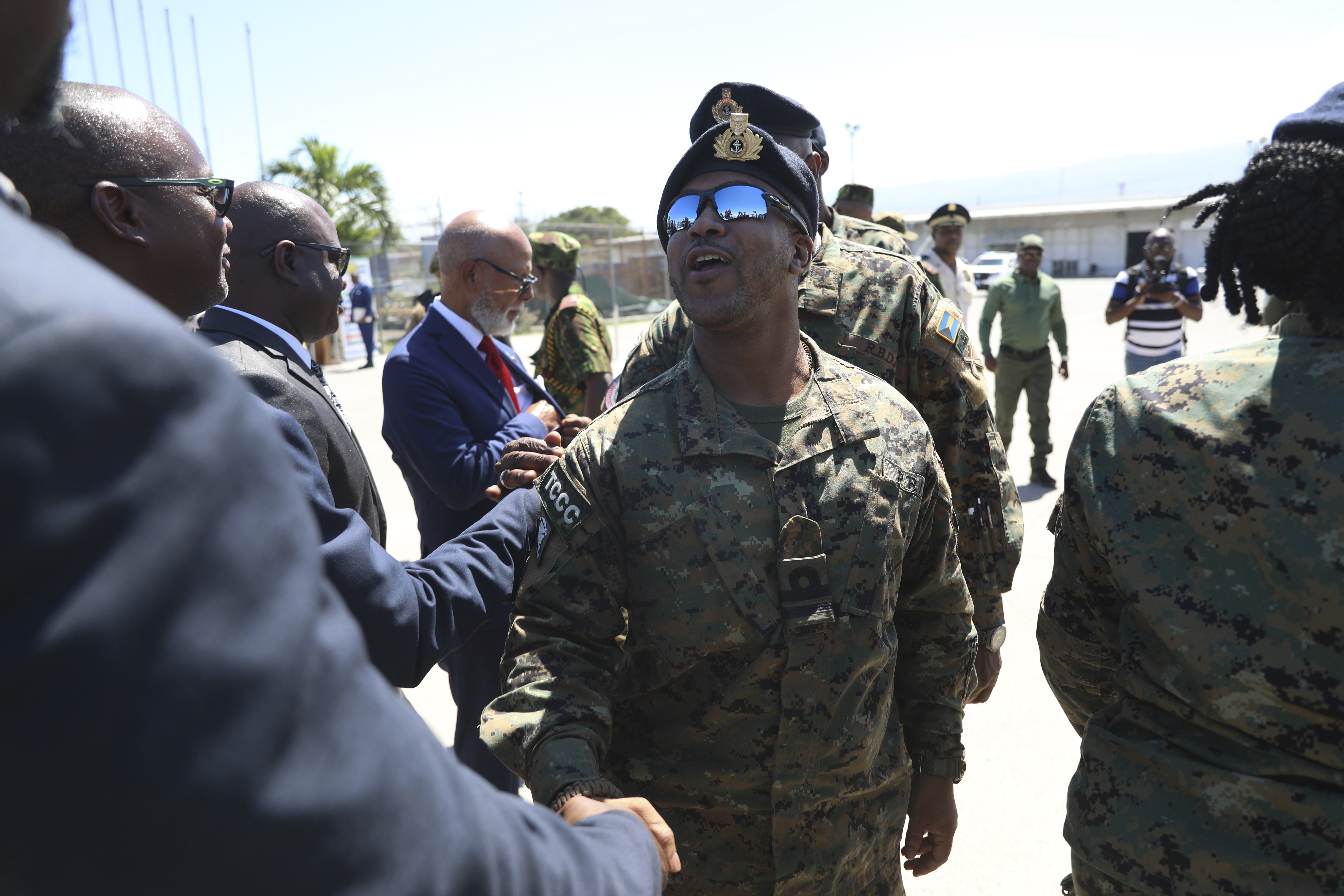 Police from the Bahamas are welcomed by Haitian and Kenyan police, part of a UN-backed multinational force, at the Toussaint Louverture International Airport in Port-au-Prince, Haiti, Friday, Oct. 18, 2024. (AP Photo/Odelyn Joseph)