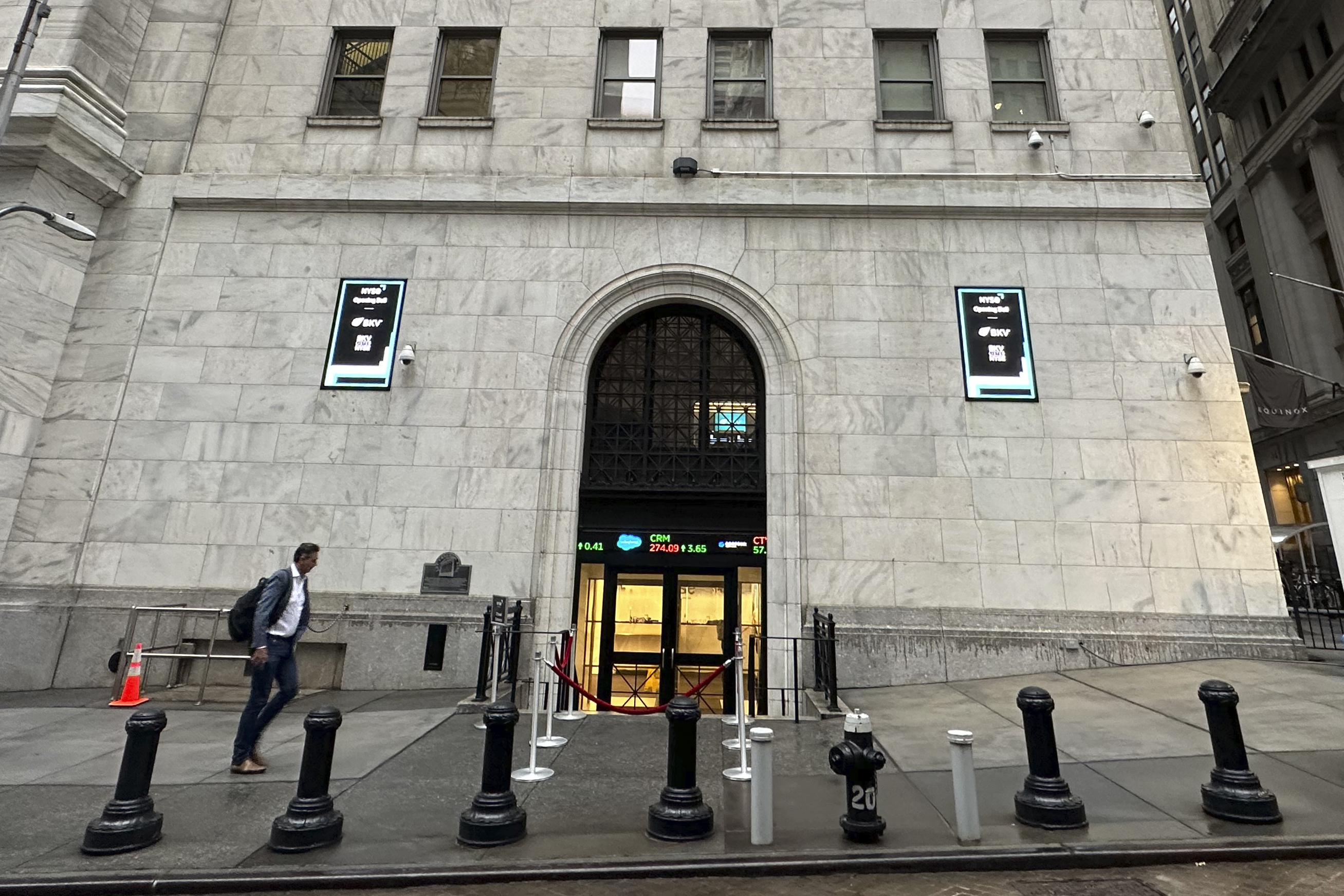 FILE - A man approaches an entrance to the New York Stock Exchange on Sept. 26, 2024, in New York. (AP Photo/Peter Morgan, File)