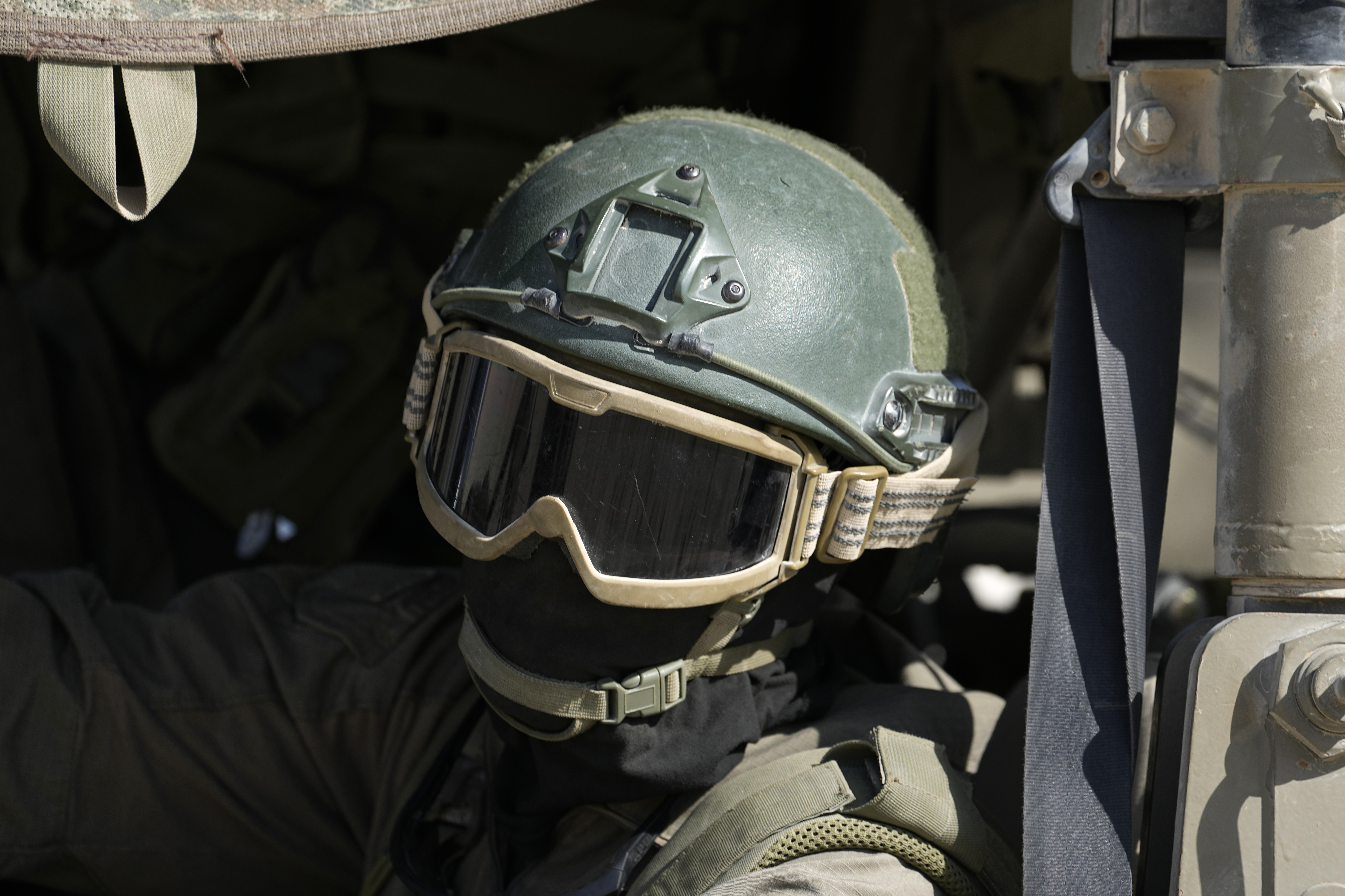 An Israeli soldier drives in a vehicle on the Israel-Gaza border, as seen from southern Israel, Friday, Oct. 18, 2024. (AP Photo/Tsafrir Abayov)