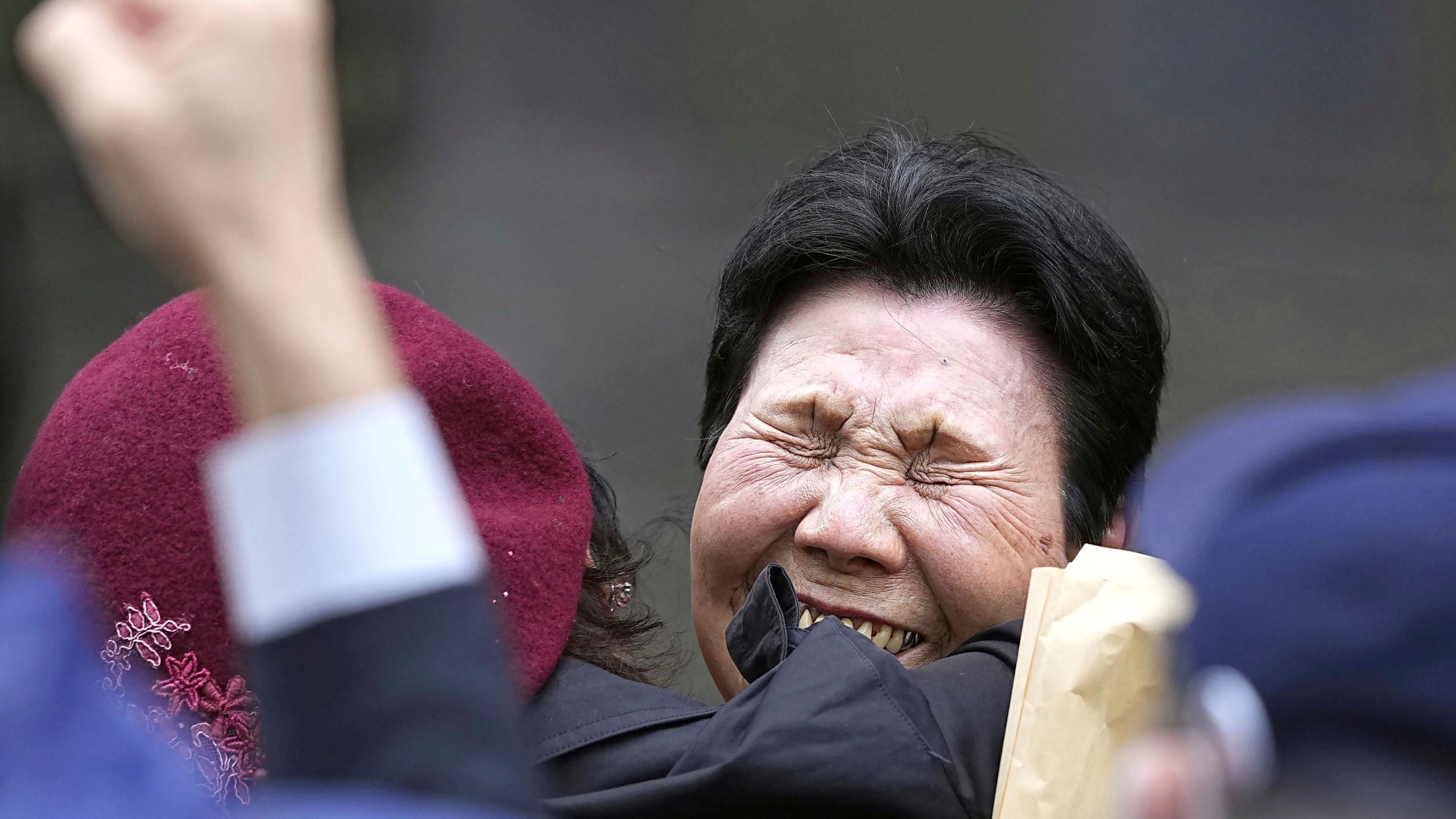 Hideko Hakamada, center right, sister of former boxer Iwao Hakamada who has been on death row for a 1966 quadruple murder case, celebrates with a supporter after Tokyo High Court granted a retrial for her brother in front of the court in Tokyo, on March 13, 2023. Japanese prosecutors said on Oct. 8, 2024 they will not appeal the Sept. 26 ruling of the Shizuoka District Court that acquitted the world’s longest-serving death-row inmate in a retrial. (Kyodo News via AP)