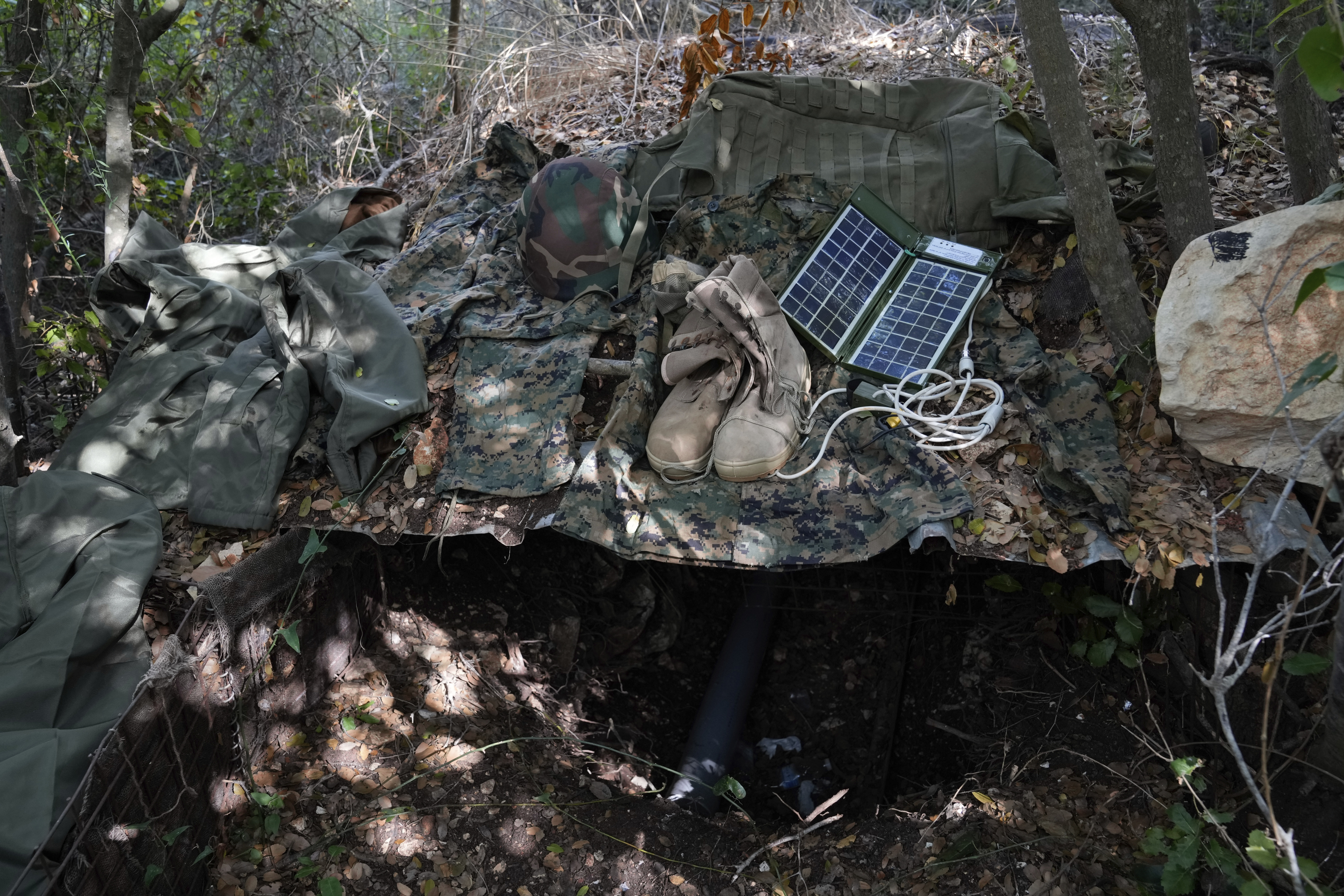 Israeli soldiers display to the media what they say is Hezbollah gear found during their ground operation in southern Lebanon, near the border with Israel, Sunday, Oct. 13, 2024. (AP Photo/Sam McNeil)