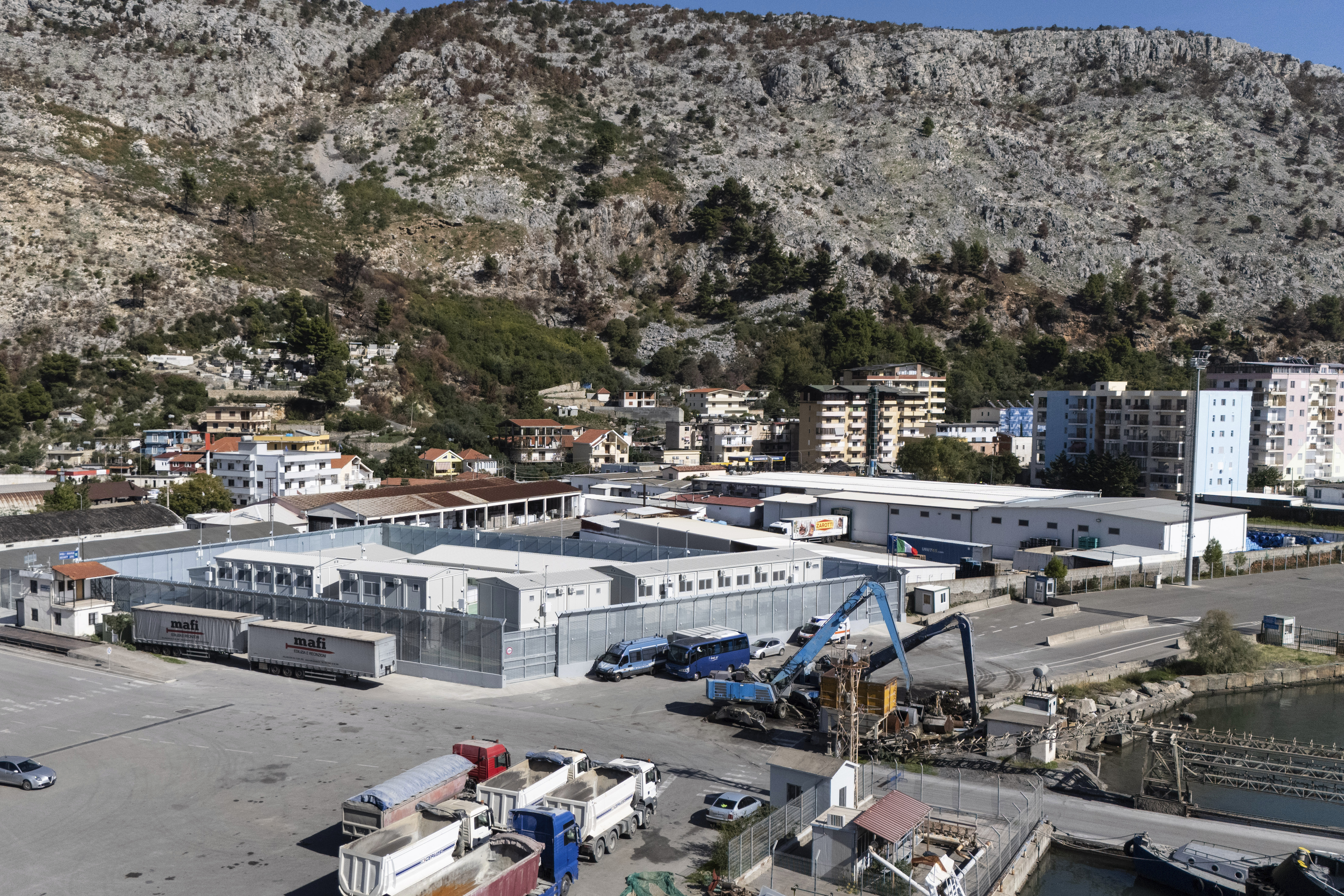 A general view of a migrant processing center at the port of Shengjin, northwestern Albania Wednesday, Oct. 16, 2024, as the first group of migrants who were intercepted in international waters arrived Wednesday. (AP Photo/Vlasov Sulaj)