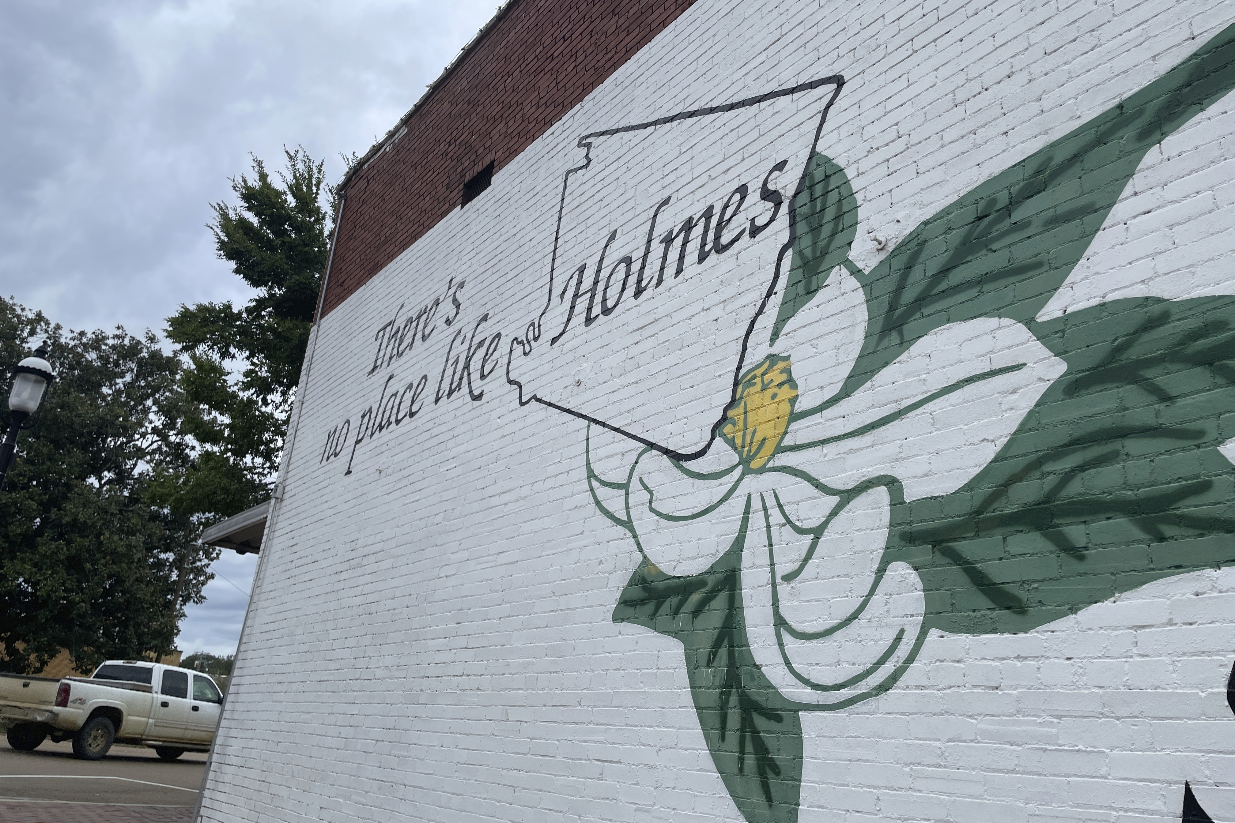 A mural promoting Holmes County, Mississippi, is shown in the side of a building in downtown Lexington, Miss., on Friday, Sept. 27, 2024. (AP Photo/Emily Wagster Pettus)