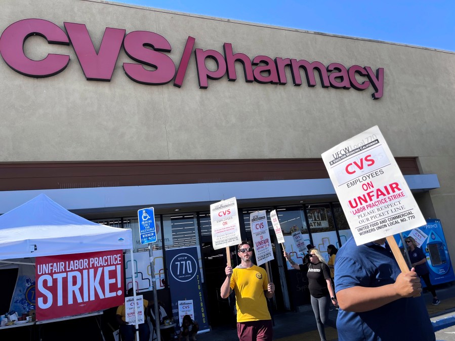 Workers on strike picket in front of a CVS pharmacy on Saturday, Oct. 19, 2024, in Los Angeles. (AP Photo/Jaimie Ding)