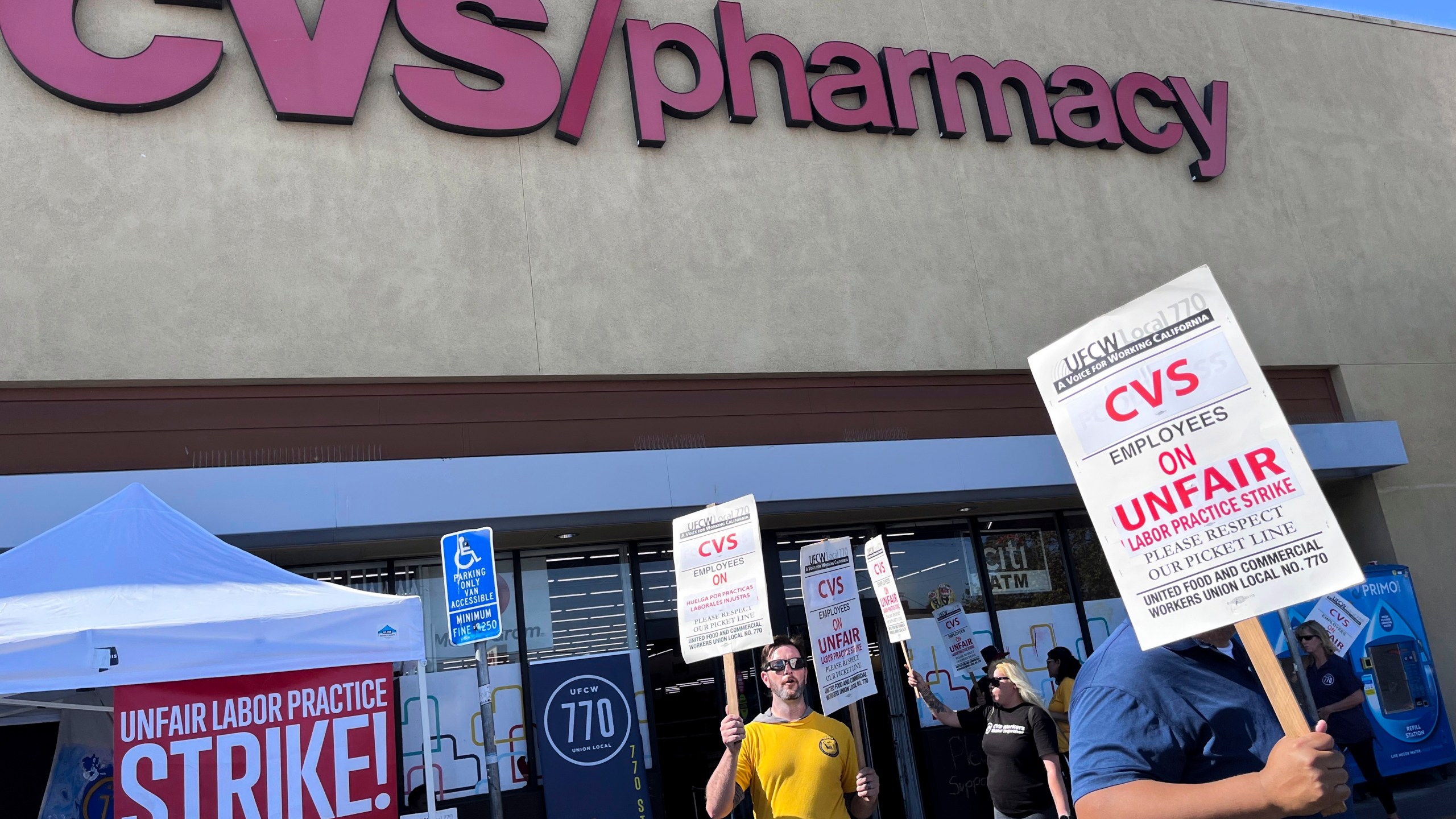 Workers on strike picket in front of a CVS pharmacy on Saturday, Oct. 19, 2024, in Los Angeles. (AP Photo/Jaimie Ding)