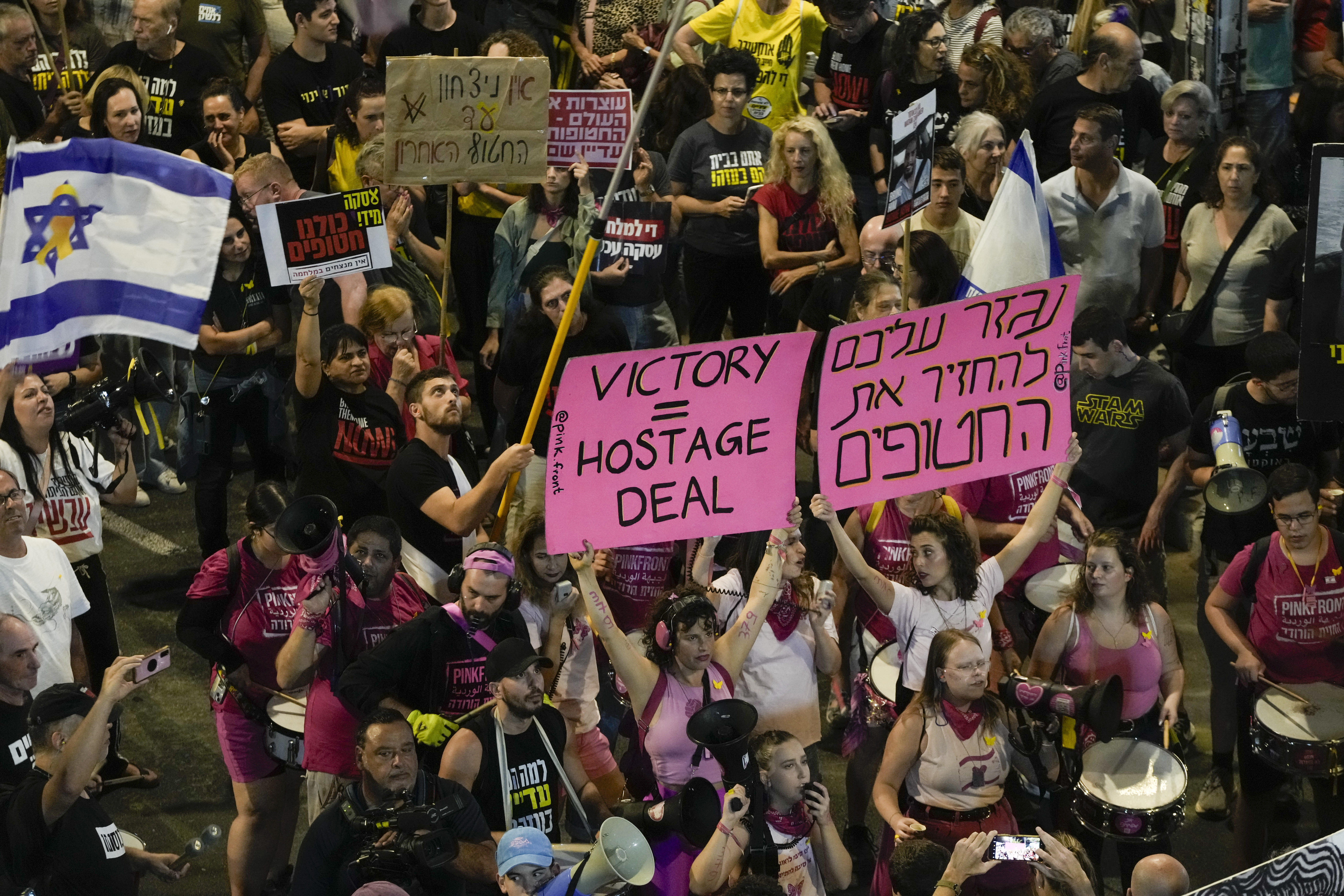 People protest against Prime Minister Benjamin Netanyahu's government and call for the release of hostages held in the Gaza Strip by the Hamas militant group, in Tel Aviv, Israel, Saturday, Oct. 19, 2024. (AP Photo/Mahmoud Illean)