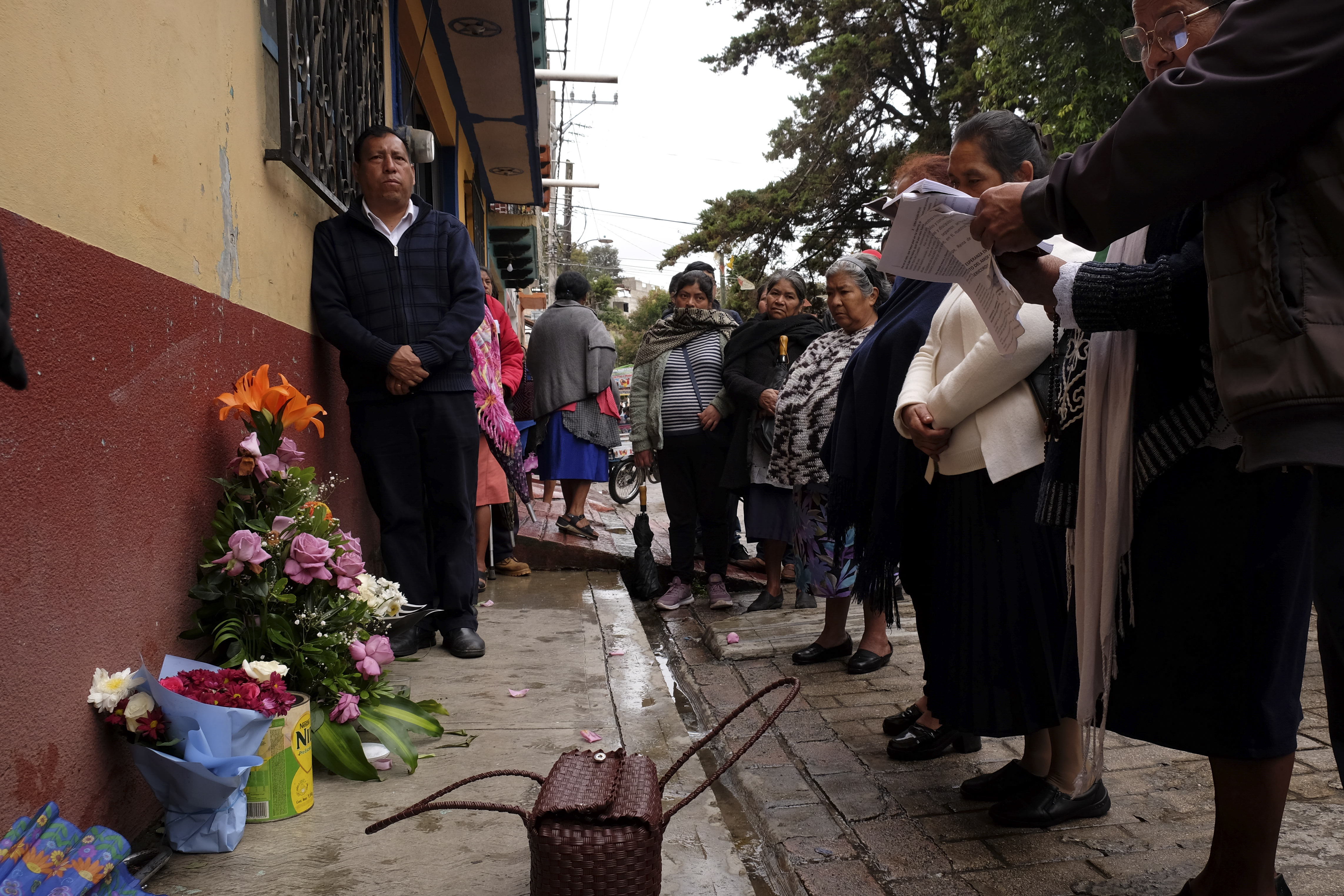 People gather around an altar where Catholic priest Marcelo Perez died in an armed attack after attending mass at a church in San Cristobal de las Casas, Chiapas state, Mexico, Sunday, Oct. 20, 2024. (AP Photo/Isabel Mateos)