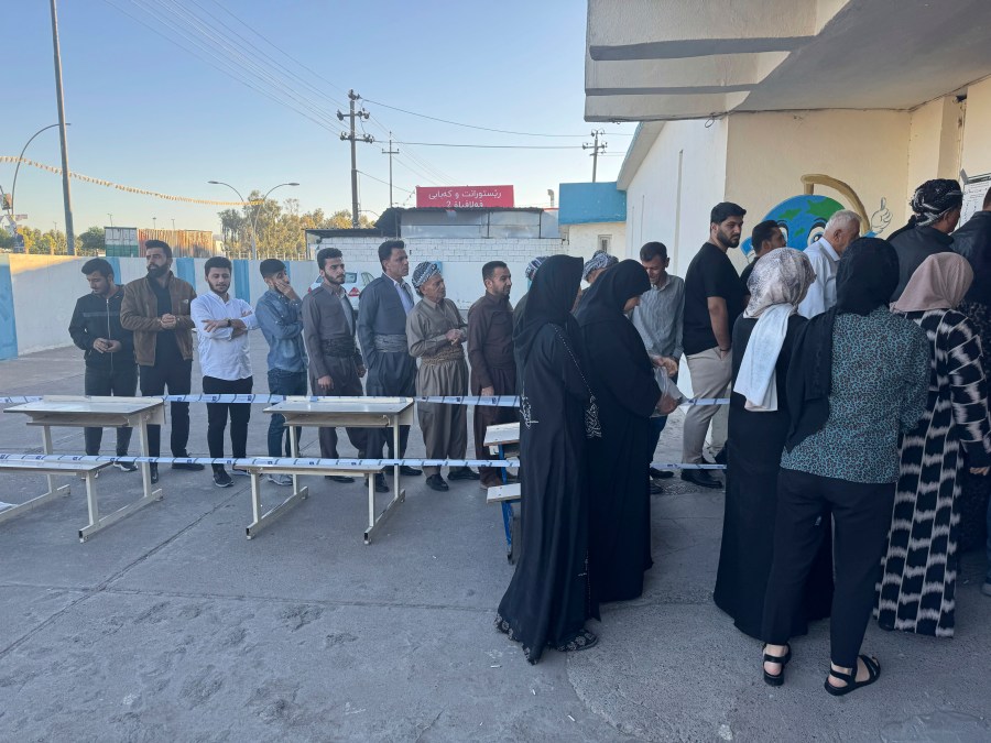 People line up to vote during parliamentary elections of Iraq’s semi-autonomous northern Kurdish region, in Irbil, Sunday, Oct. 20, 2024. (AP Photo/Salar Salim)