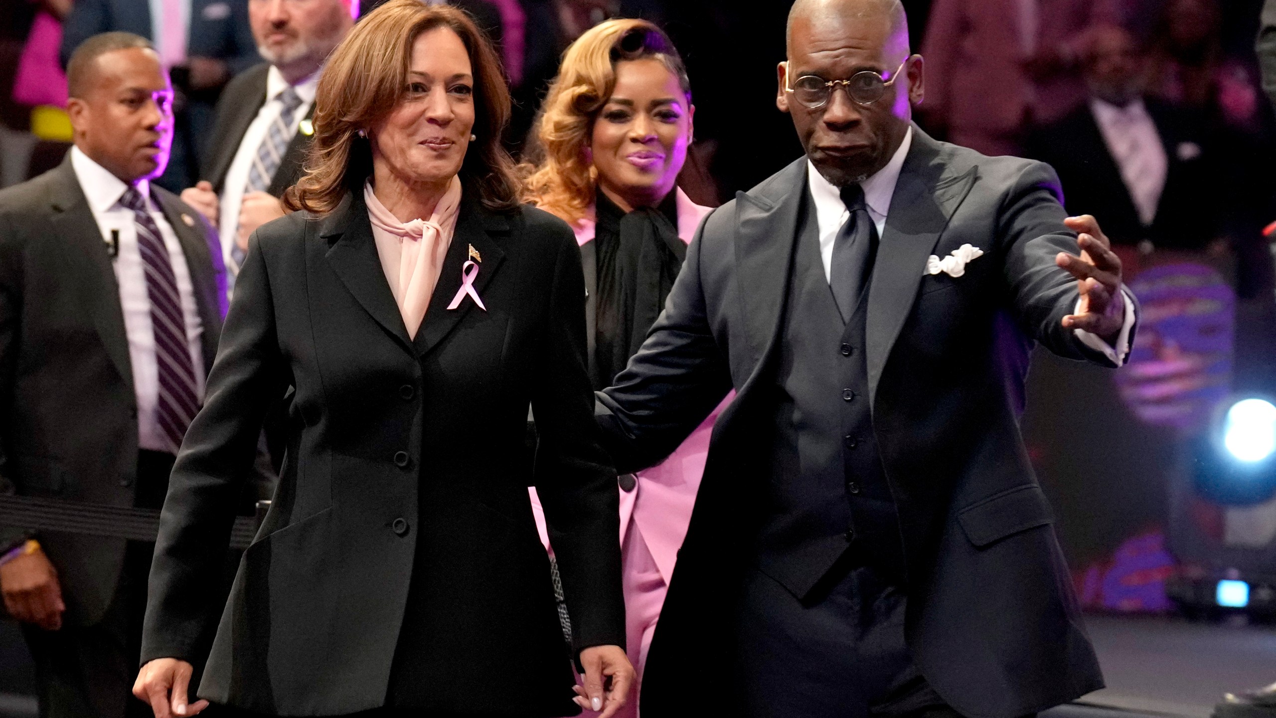 Democratic presidential nominee Vice President Kamala Harris, left, and pastor Jamal Bryant arrive at a church service at New Birth Baptist Church in Stonecrest, Ga., Sunday, Oct. 20, 2024. (AP Photo/Jacquelyn Martin)