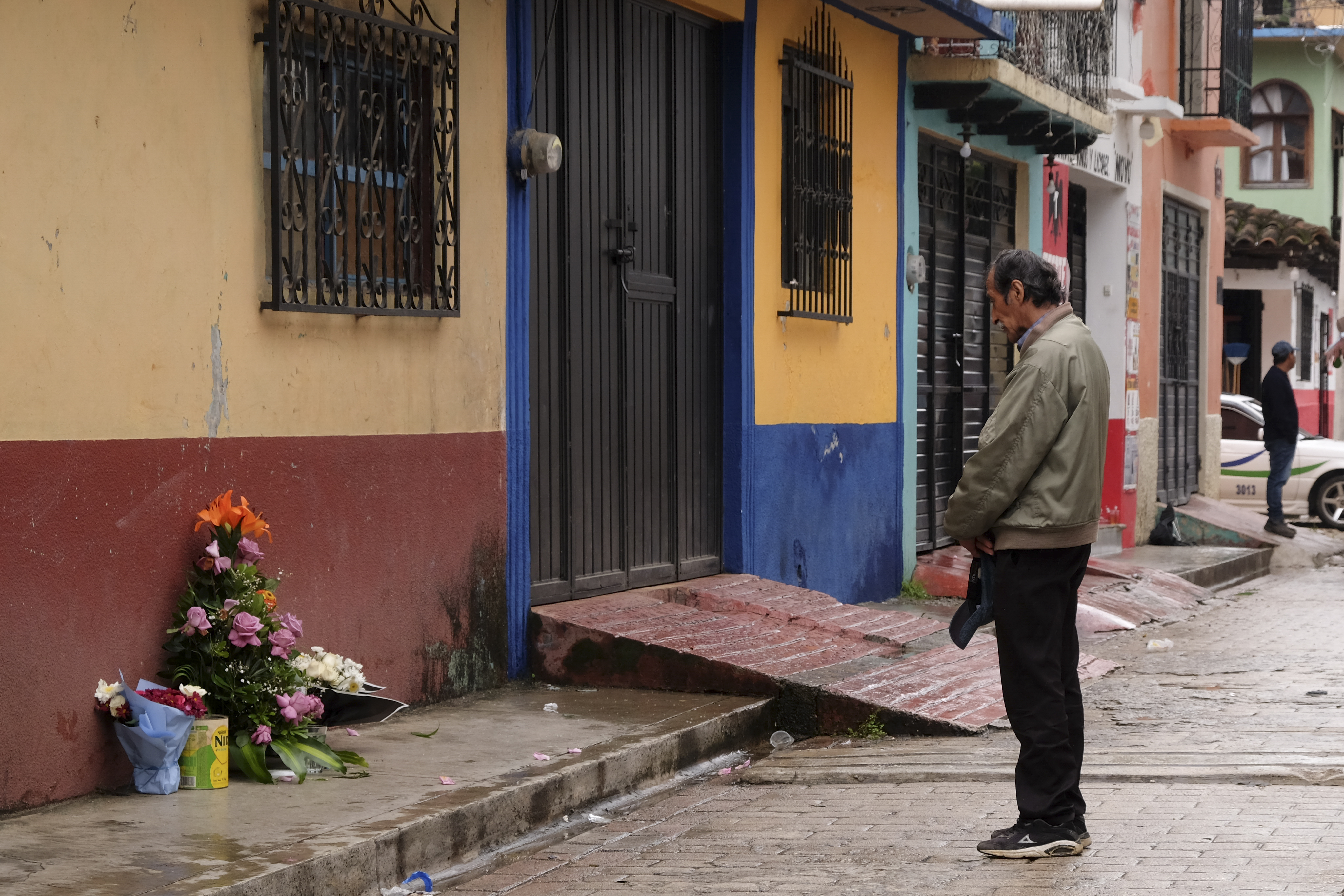 A man prays in front of an altar where Catholic priest Marcelo Perez was killed in an armed attack after attending mass at a church in San Cristobal de las Casas, Chiapas state, Mexico, Sunday, Oct. 20, 2024. (AP Photo/Isabel Mateos)