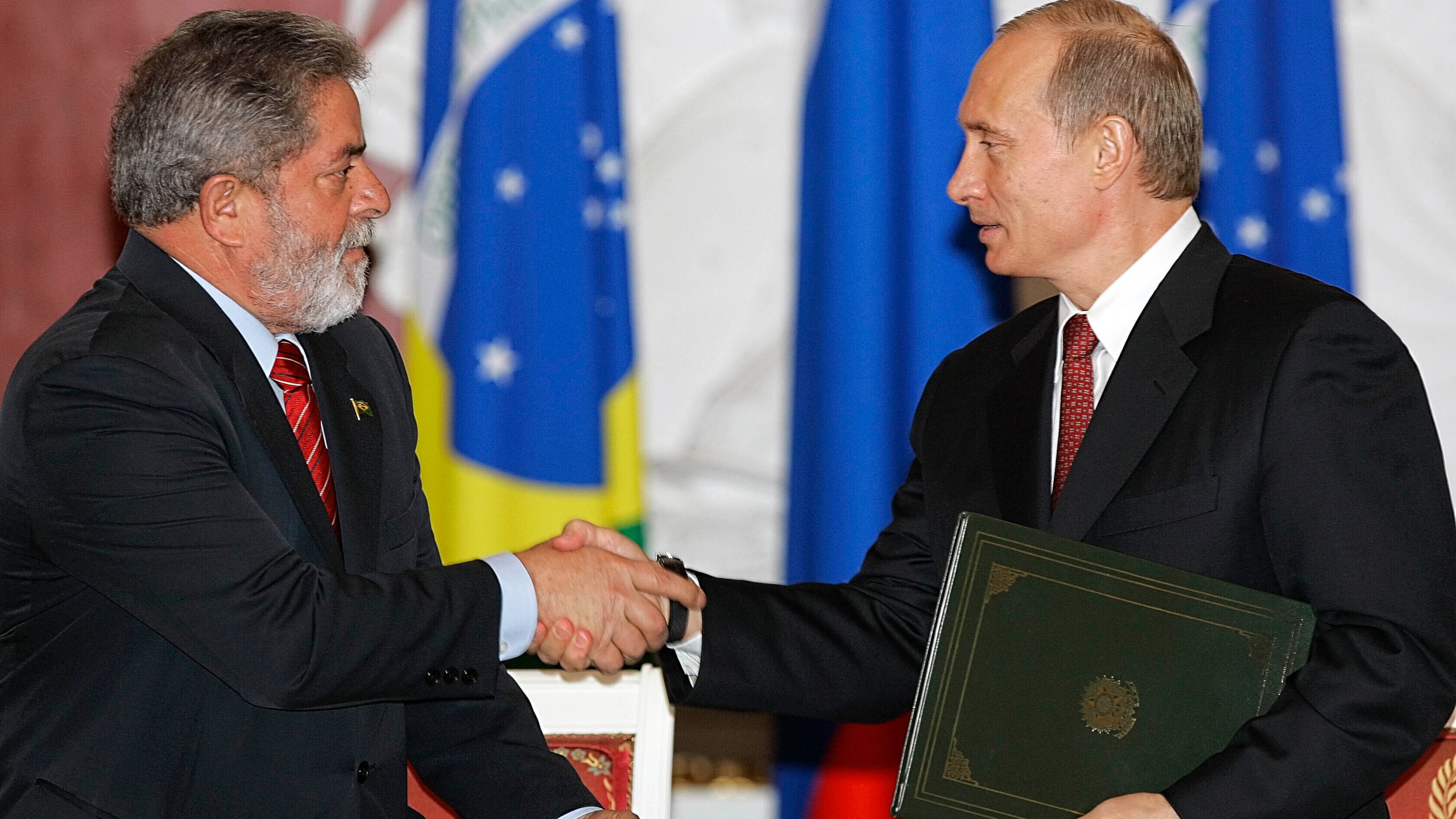 FILE - Russian President Vladimir Putin, right, and Brazilian President Luiz Inacio Lula da Silva shake hands during a ceremony in the Kremlin in Moscow, Russia, on Oct. 18, 2005. (AP Photo/Alexander Zemlianichenko, File)