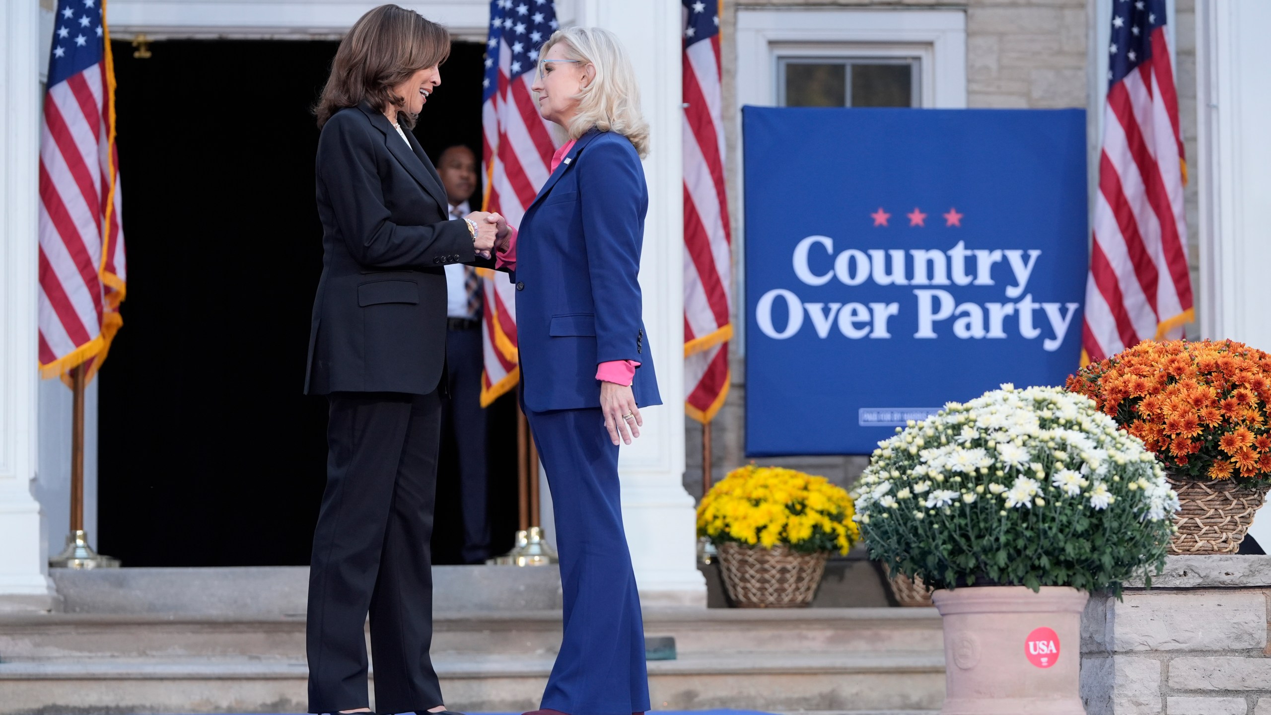 Democratic presidential nominee Vice President Kamala Harris, left, is greeted by former Congresswoman Liz Cheney, R-Wyo., during a campaign event at Ripon College in Ripon, Wis., Thursday, Oct. 3, 2024. (AP Photo/Mark Schiefelbein)