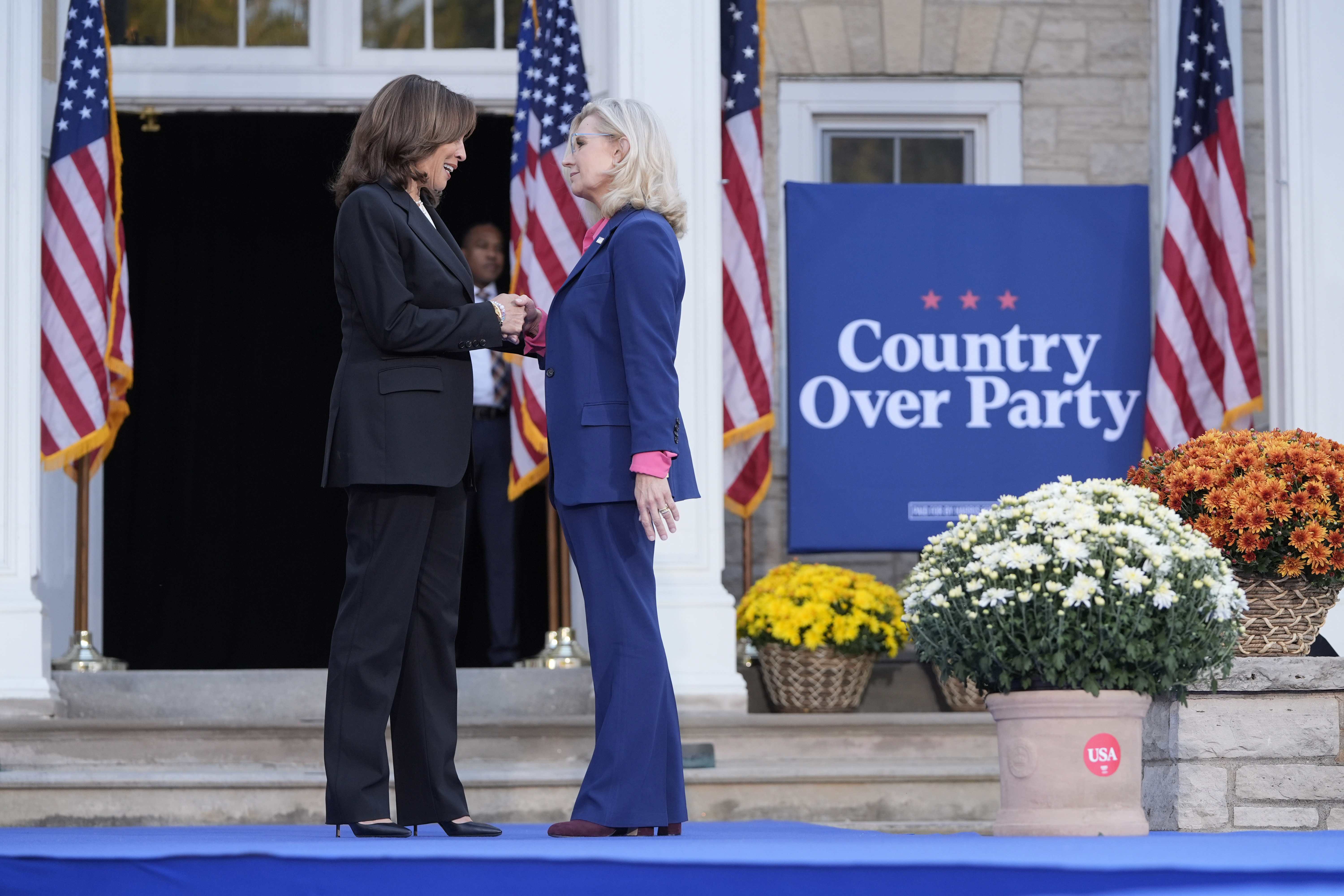 Democratic presidential nominee Vice President Kamala Harris, left, is greeted by former Congresswoman Liz Cheney, R-Wyo., during a campaign event at Ripon College in Ripon, Wis., Thursday, Oct. 3, 2024. (AP Photo/Mark Schiefelbein)