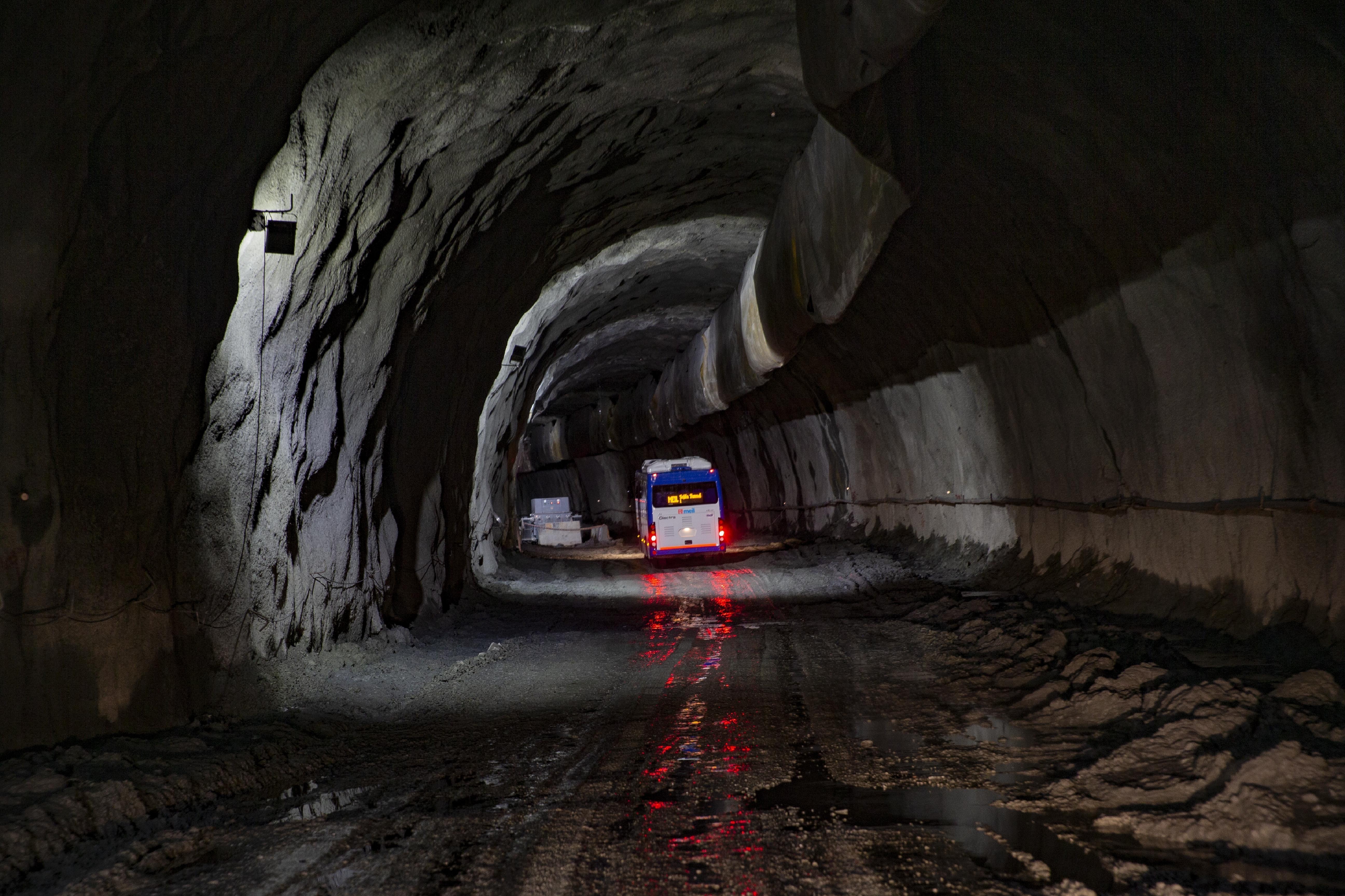 FILE -A bus carrying journalists takes a tour of the under construction Z-Morh tunnel in Sonamarg, northeast of Srinagar, Indian controlled Kashmir, Sept. 28, 2021. (AP Photo/Dar Yasin, File)