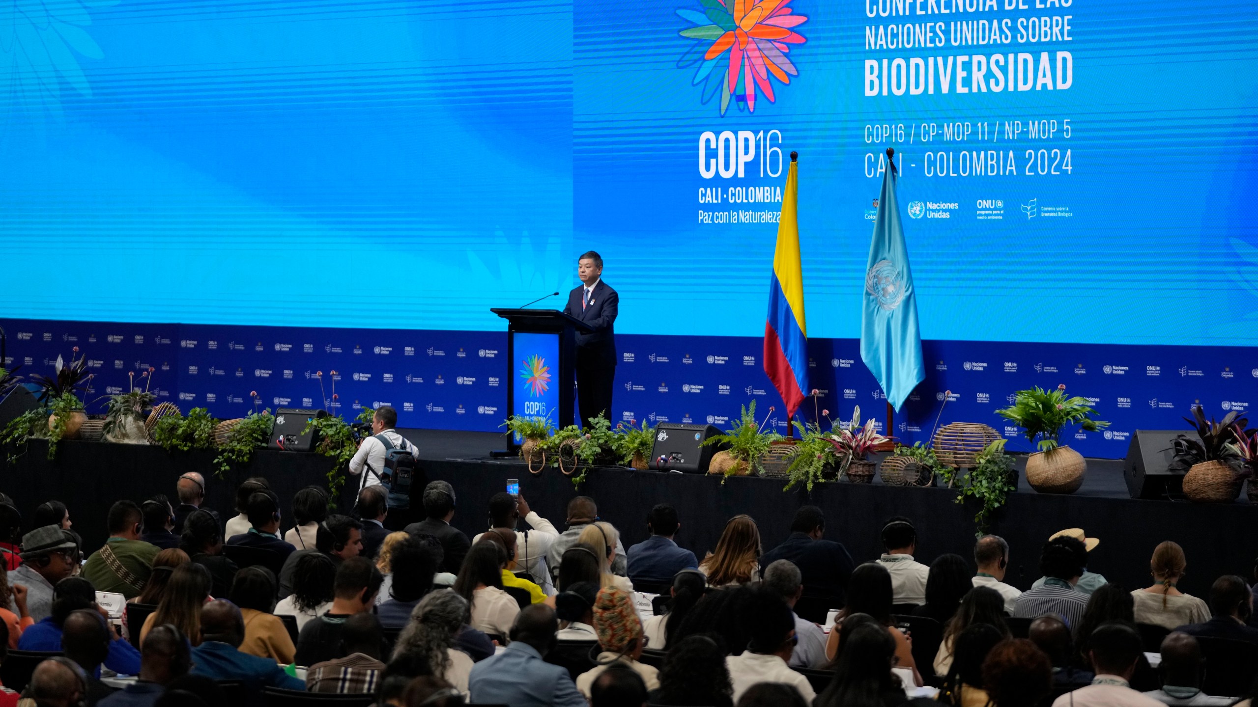 Huang Runqiu, China's minister of ecology and environment, delivers a speech at the opening ceremony of COP16, a United Nations' biodiversity conference, in Cali, Colombia, Sunday, Oct. 20, 2024. (AP Photo/Fernando Vergara)