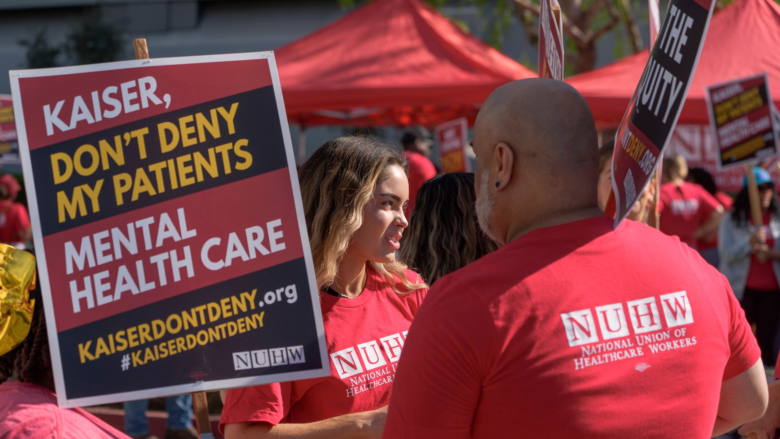 Mental health workers with the National Union of Healthcare Workers (NUHW) outside a Kaiser Permanente facility in Los Angeles Monday, Oct. 21, 2024. (AP Photo/Damian Dovarganes)