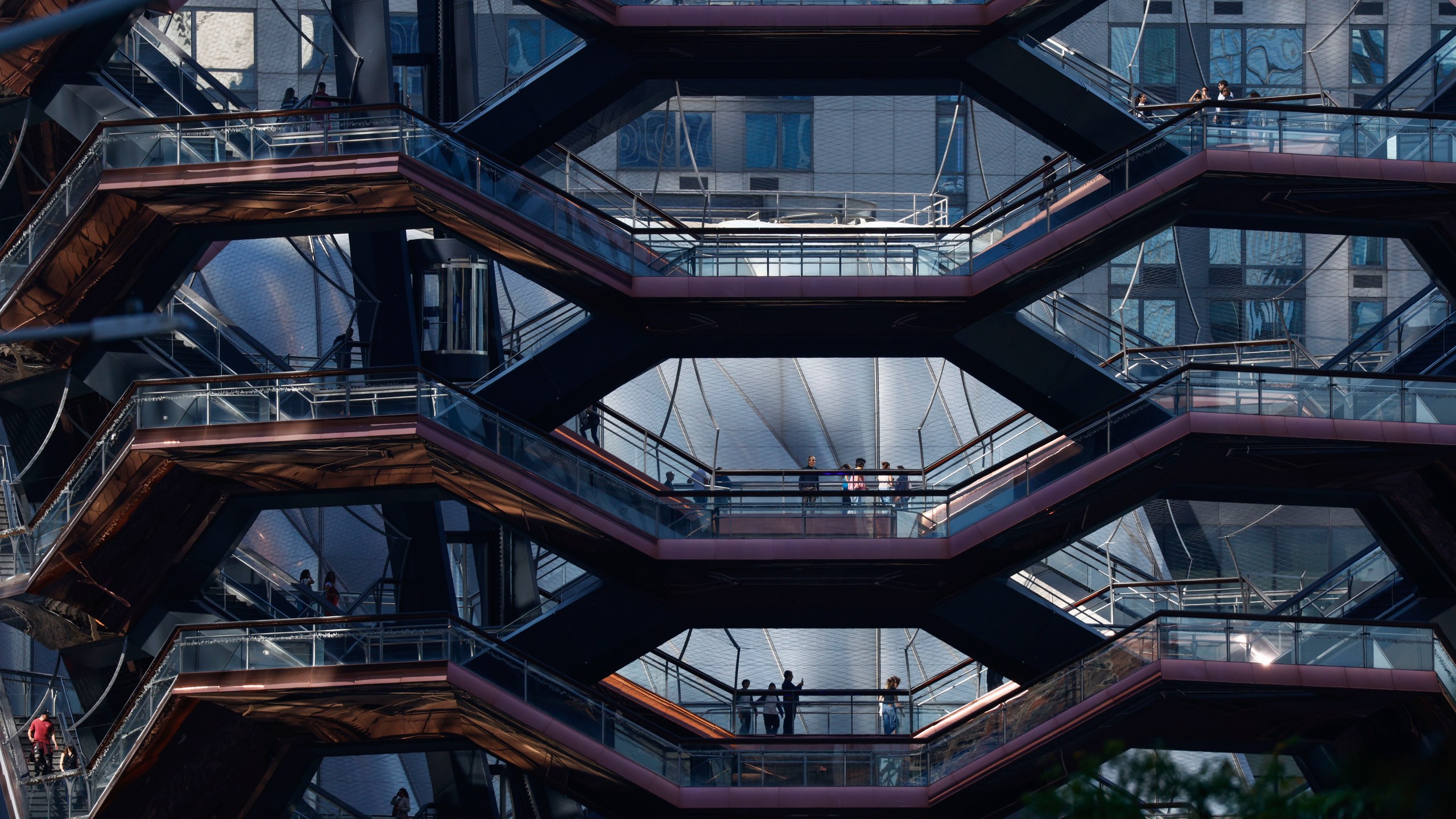 People visit the Vessel as it reopens with safety features in New York, Monday, Oct. 21, 2024. (AP Photo/Kena Betancur)