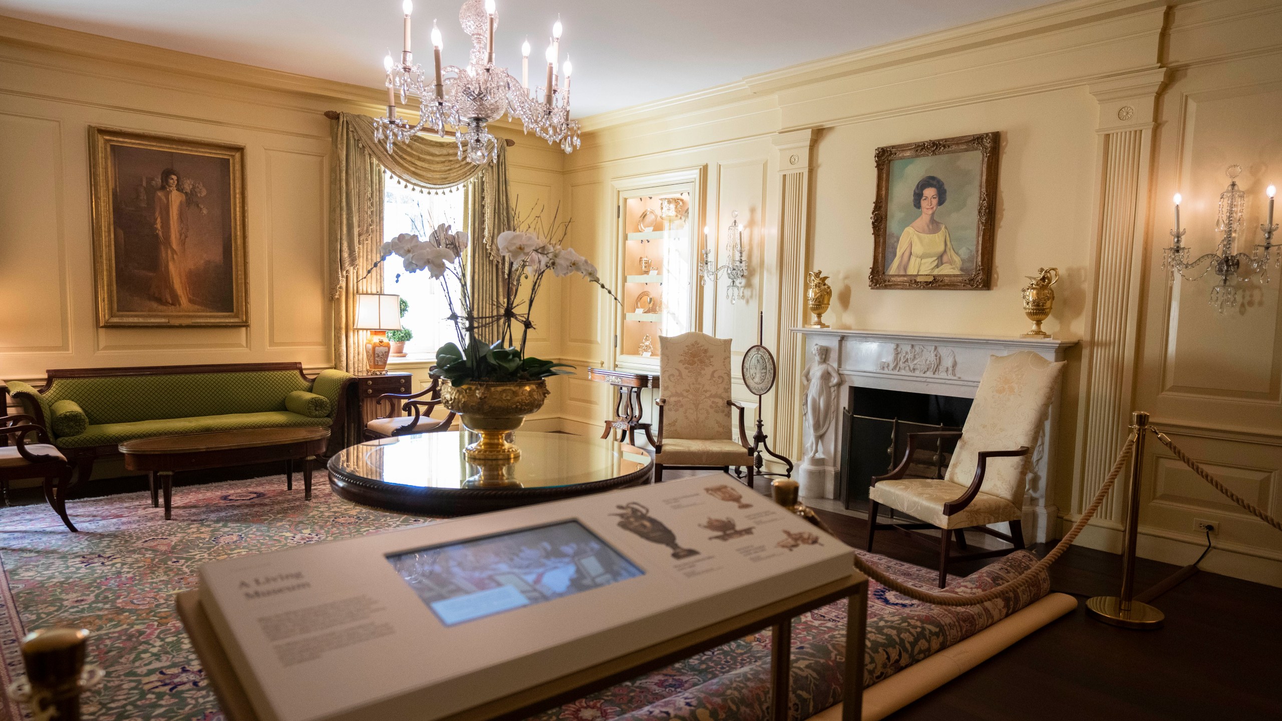 First ladies' portraits including former first lady Jacqueline Kennedy Onassis, left, and former first lady Lady Bird Johnson, right, adorn the Vermeil Room on Friday, Oct. 18, 2024. (AP Photo/Manuel Balce Ceneta)