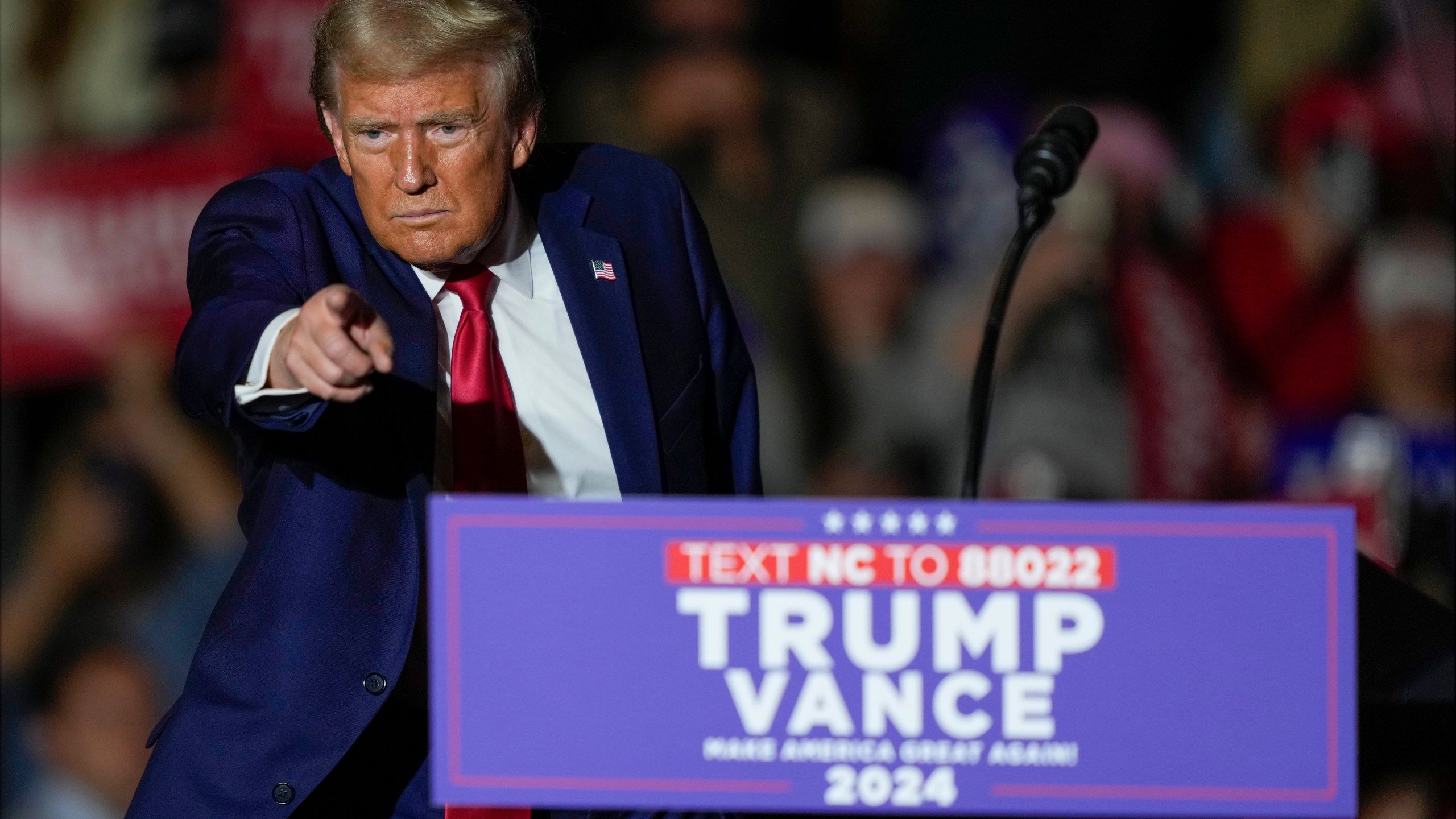 Republican presidential nominee former President Donald Trump gestures after speaking at a campaign rally at Williams Arena at Mignes Coliseum, Monday, Oct. 21, 2024, in Greenville, N.C. (AP Photo/Julia Demaree Nikhinson)