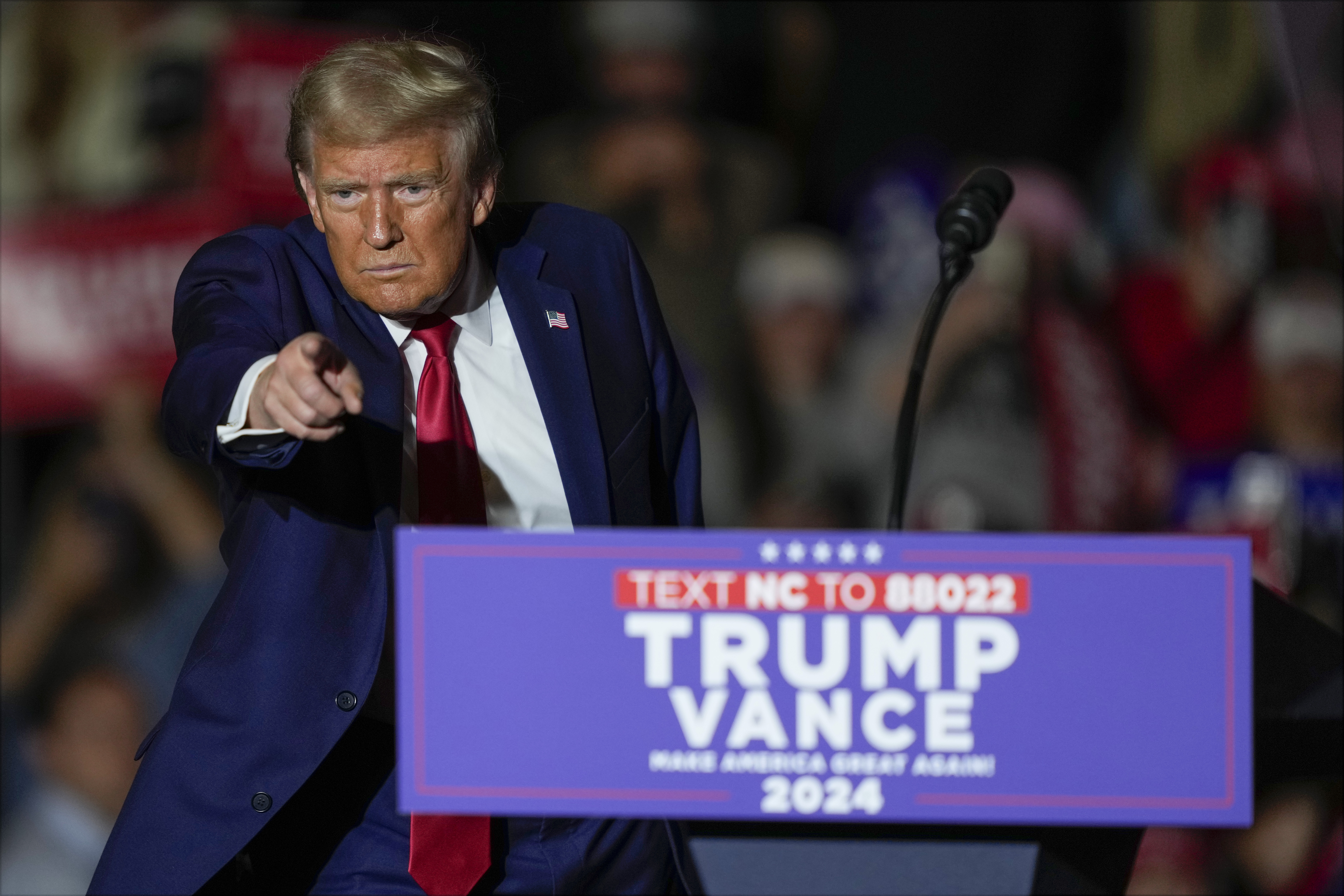 Republican presidential nominee former President Donald Trump gestures after speaking at a campaign rally at Williams Arena at Mignes Coliseum, Monday, Oct. 21, 2024, in Greenville, N.C. (AP Photo/Julia Demaree Nikhinson)