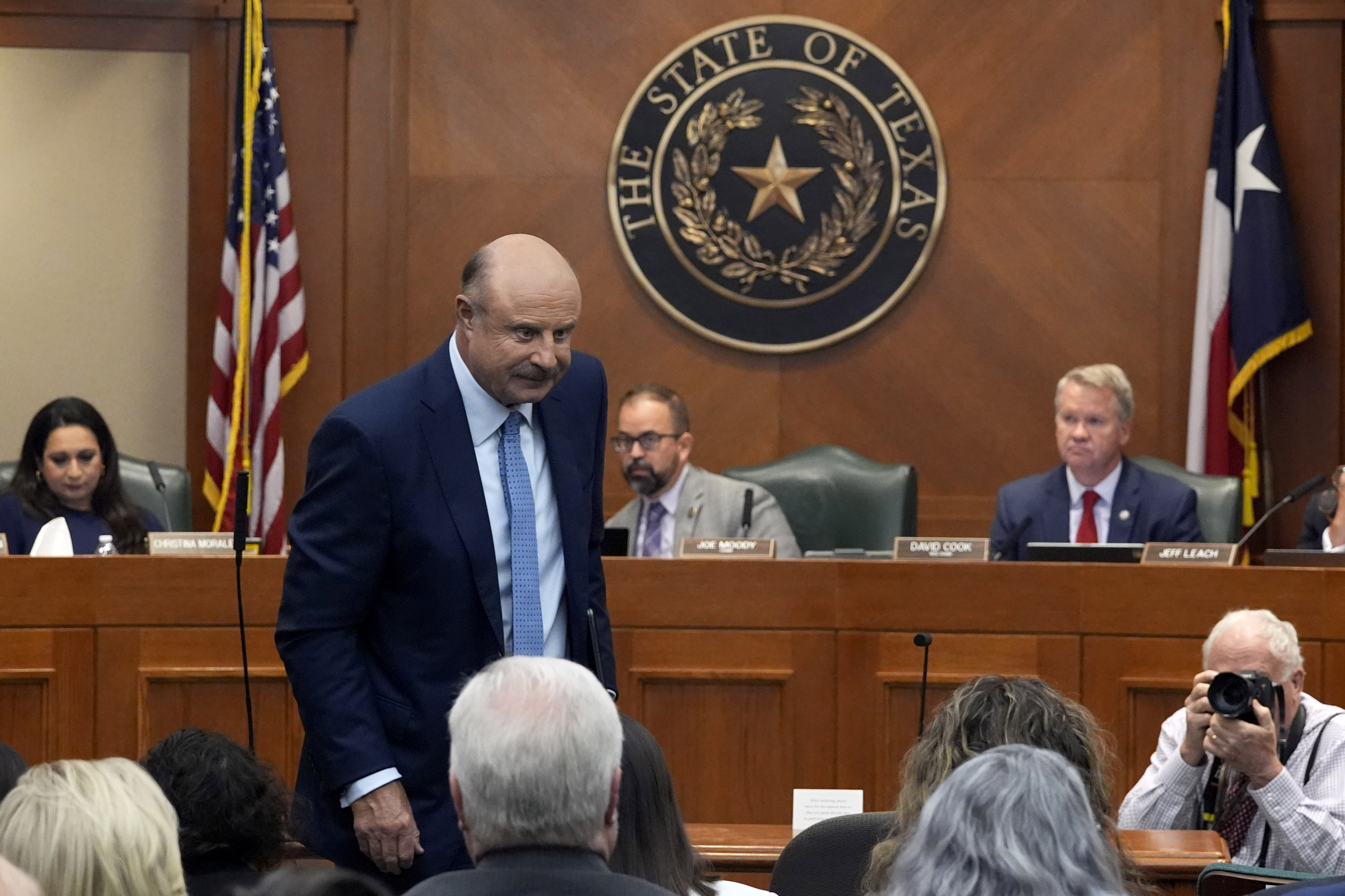 Dr. Phil McGraw stands as he leaves the room after giving testimony to a committee discussing the case of death row inmate Robert Roberson, Monday, Oct. 21, 2024, in Austin, Texas. (AP Photo/Tony Gutierrez)