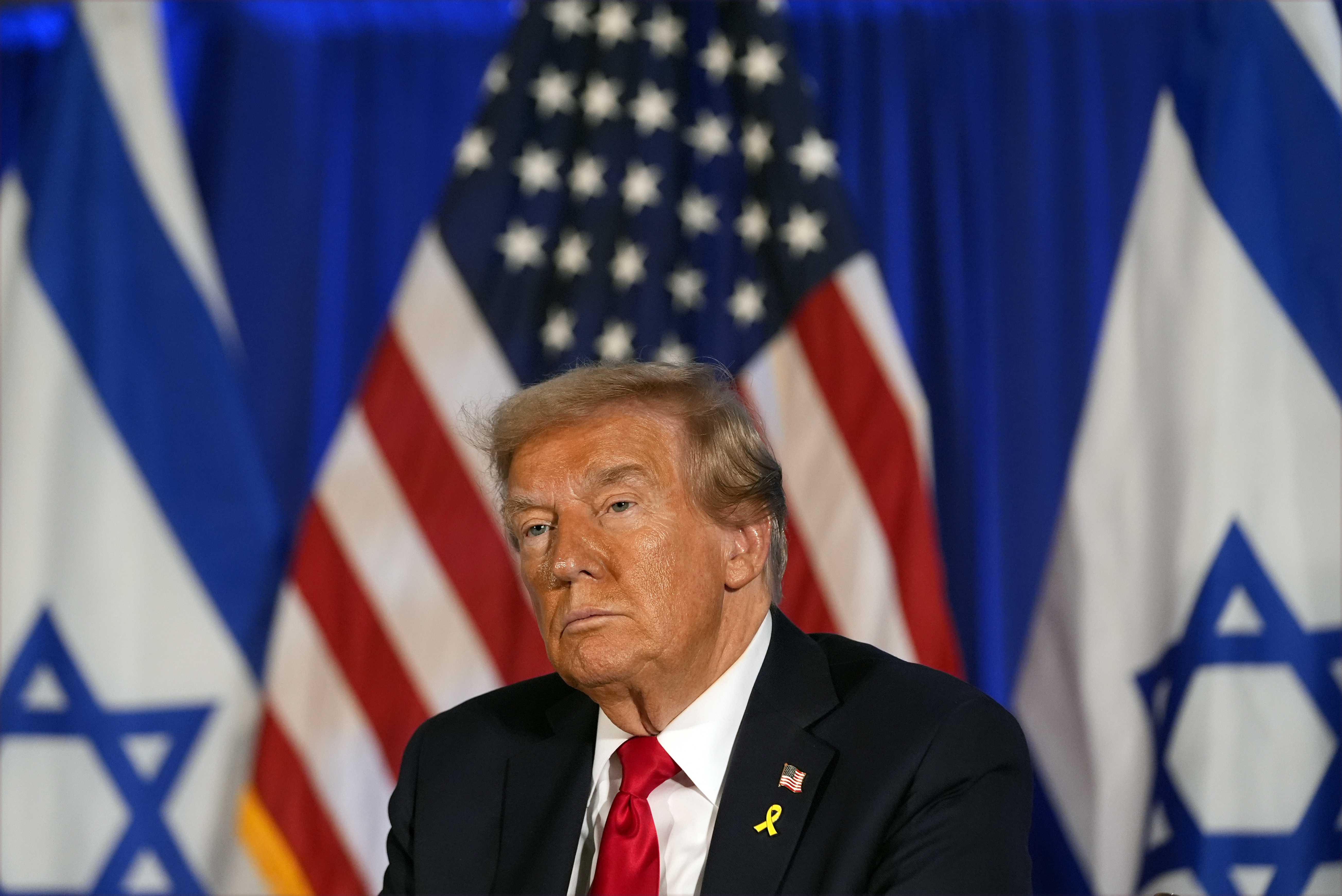 Republican presidential nominee former President Donald Trump listens at an event marking one year since the Oct. 7 Hamas attack on Israel, Monday, Oct. 7, 2024, in Miami. (AP Photo/Alex Brandon)