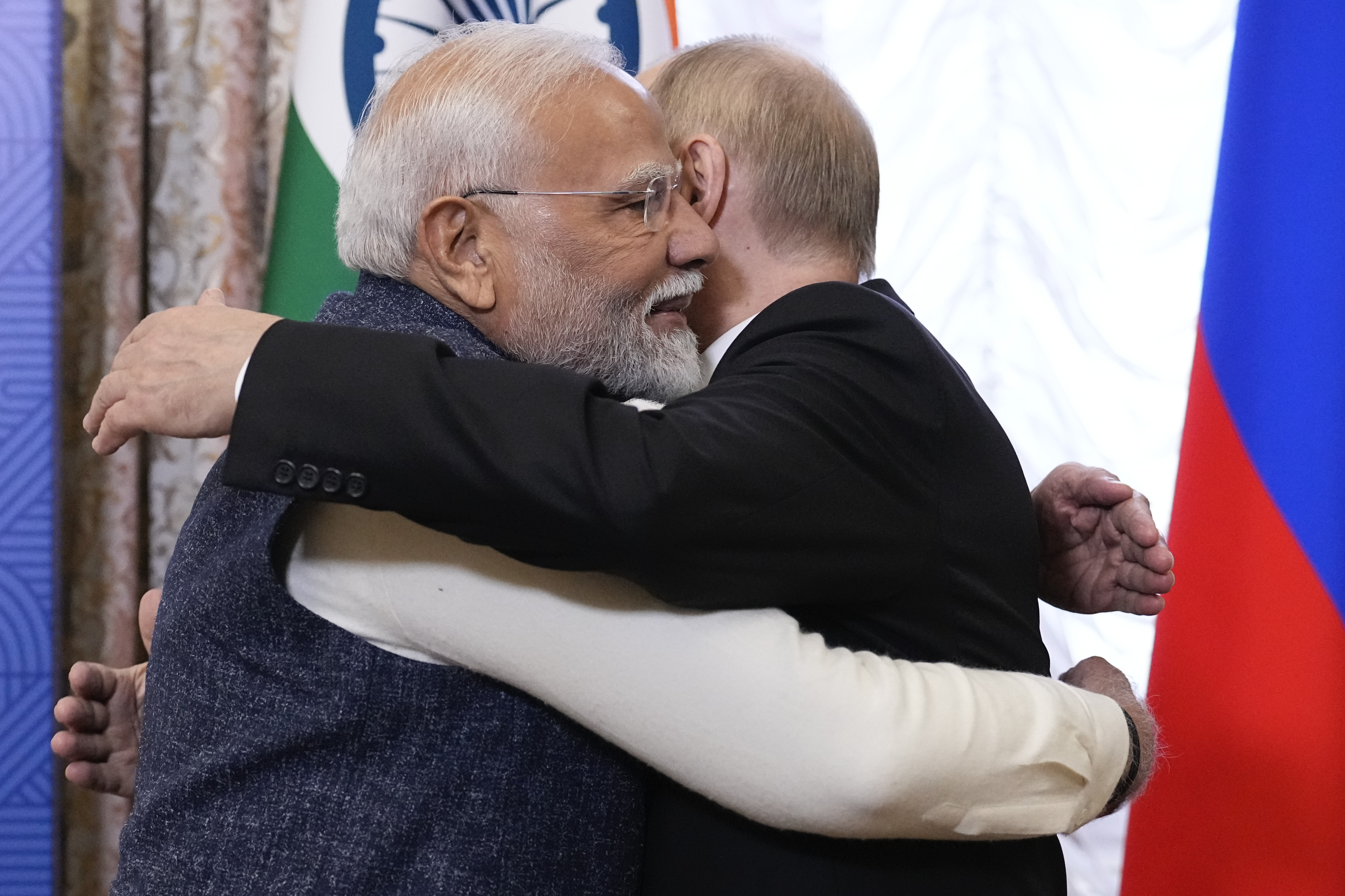 Russian President Vladimir Putin, right, embraces Indian Prime Minister Narendra Modi during their meeting on the sidelines of BRICS Summit at Kazan Kremlin in Kazan, Russia, Tuesday, Oct. 22, 2024. (AP Photo/Alexander Zemlianichenko, Pool)