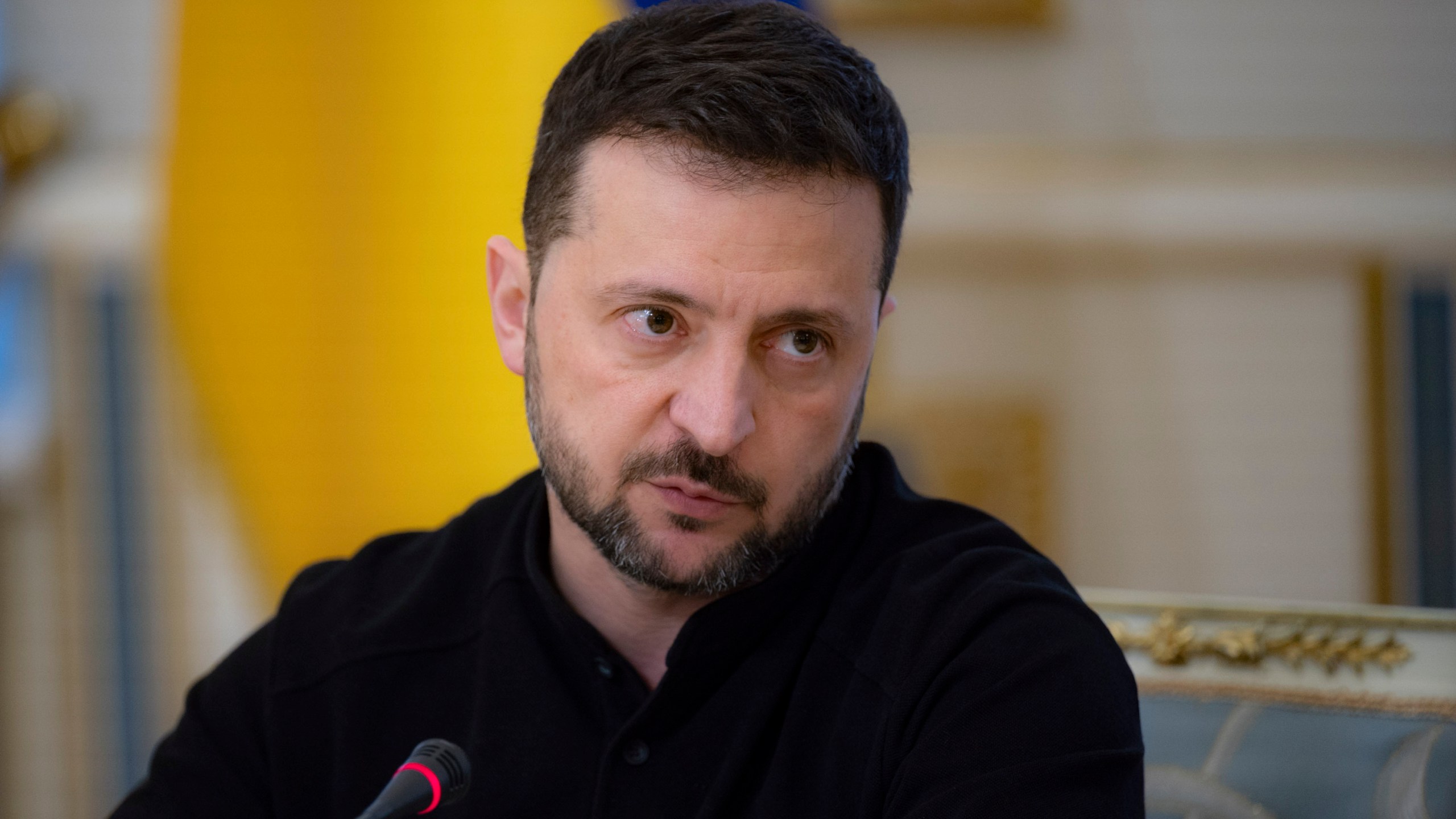 In this photo provided by the Ukrainian Presidential Press Office, Ukrainian President Volodymyr Zelenskyy talks with Ukrainian journalists in Kyiv, Ukraine, Monday, Oct. 21, 2024. (Ukrainian Presidential Press Office via AP)