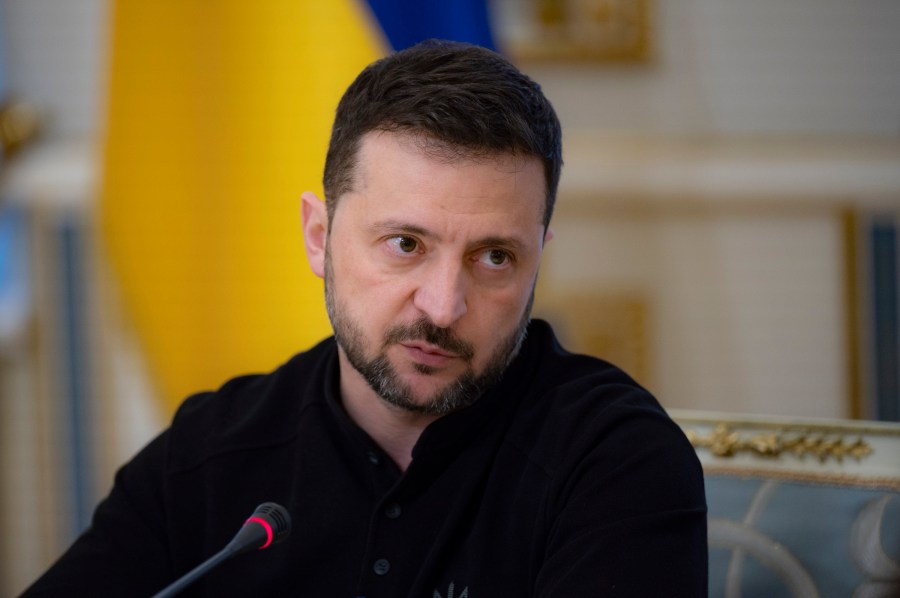 In this photo provided by the Ukrainian Presidential Press Office, Ukrainian President Volodymyr Zelenskyy talks with Ukrainian journalists in Kyiv, Ukraine, Monday, Oct. 21, 2024. (Ukrainian Presidential Press Office via AP)