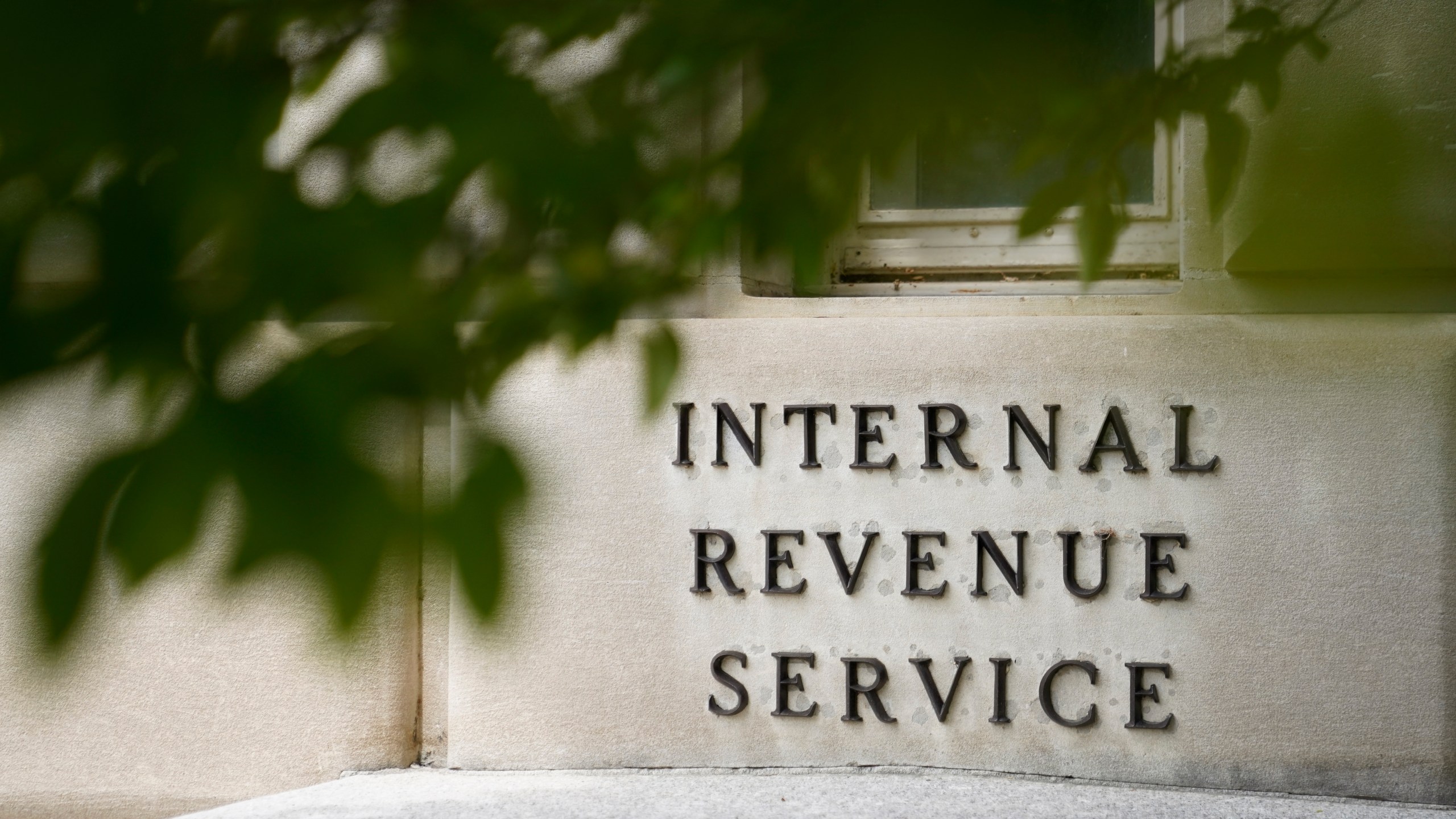 FILE - A sign is displayed outside the Internal Revenue Service building May 4, 2021, in Washington. On Friday, Aug. 19, 2022. (AP Photo/Patrick Semansky, File)