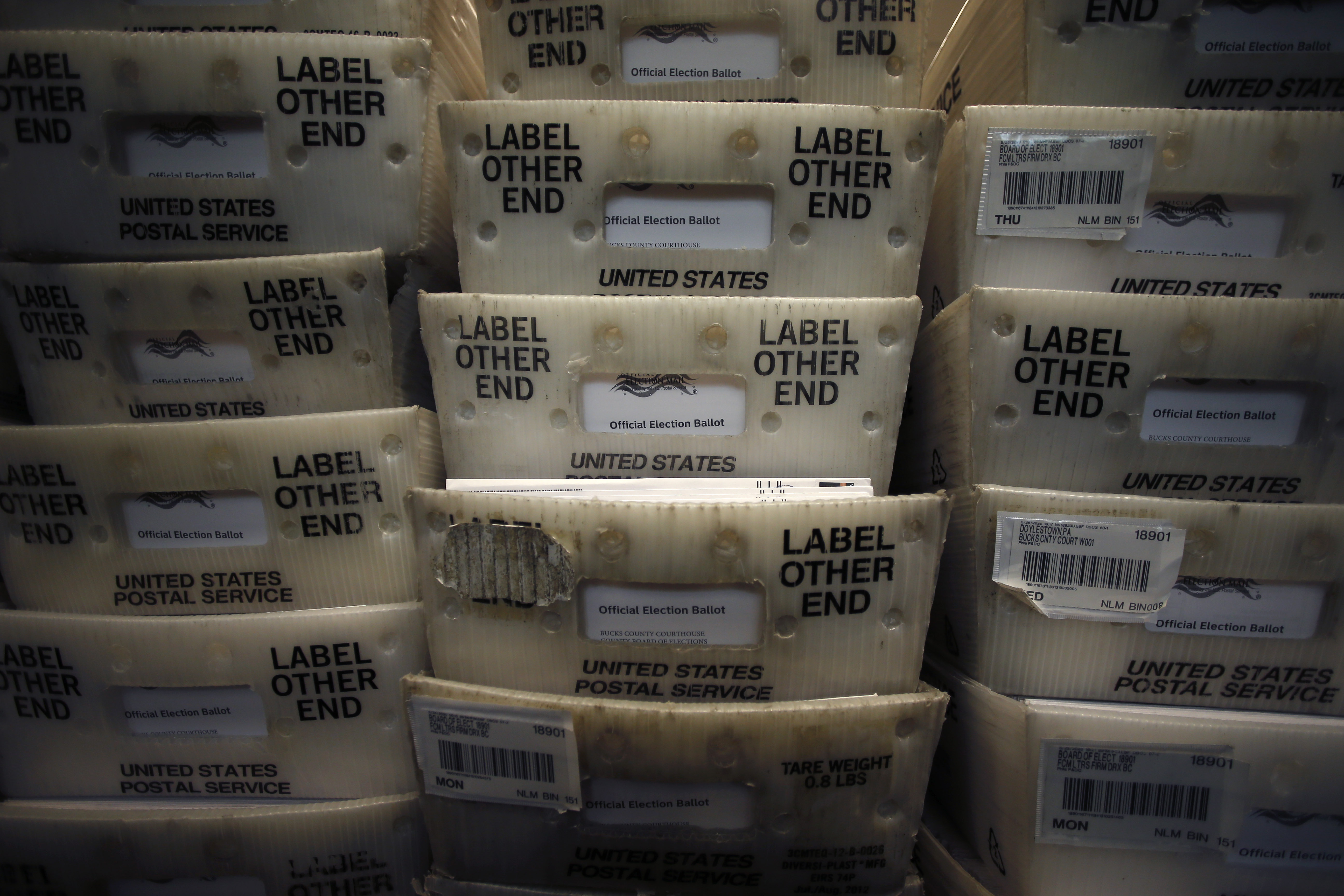 FILE - Processed mail-in ballots are seen at the Bucks County Board of Elections office prior to the primary election in Doylestown, Pa., May 27, 2020. (AP Photo/Matt Slocum, File)