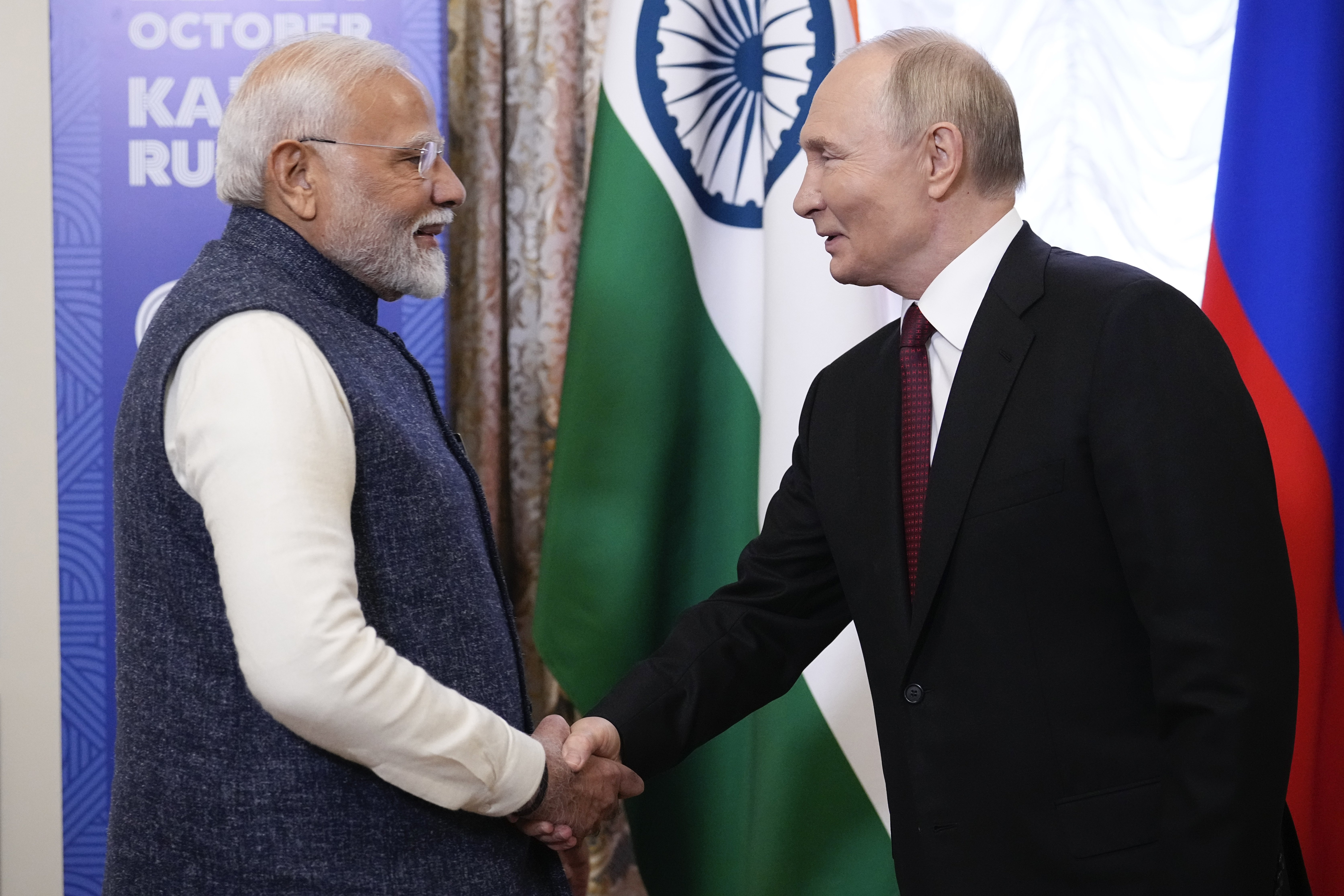 Russian President Vladimir Putin, right, and Indian Prime Minister Narendra Modi shake hands during their meeting on the sidelines of BRICS Summit at Kazan Kremlin in Kazan, Russia, Tuesday, Oct. 22, 2024. (AP Photo/Alexander Zemlianichenko, Pool)