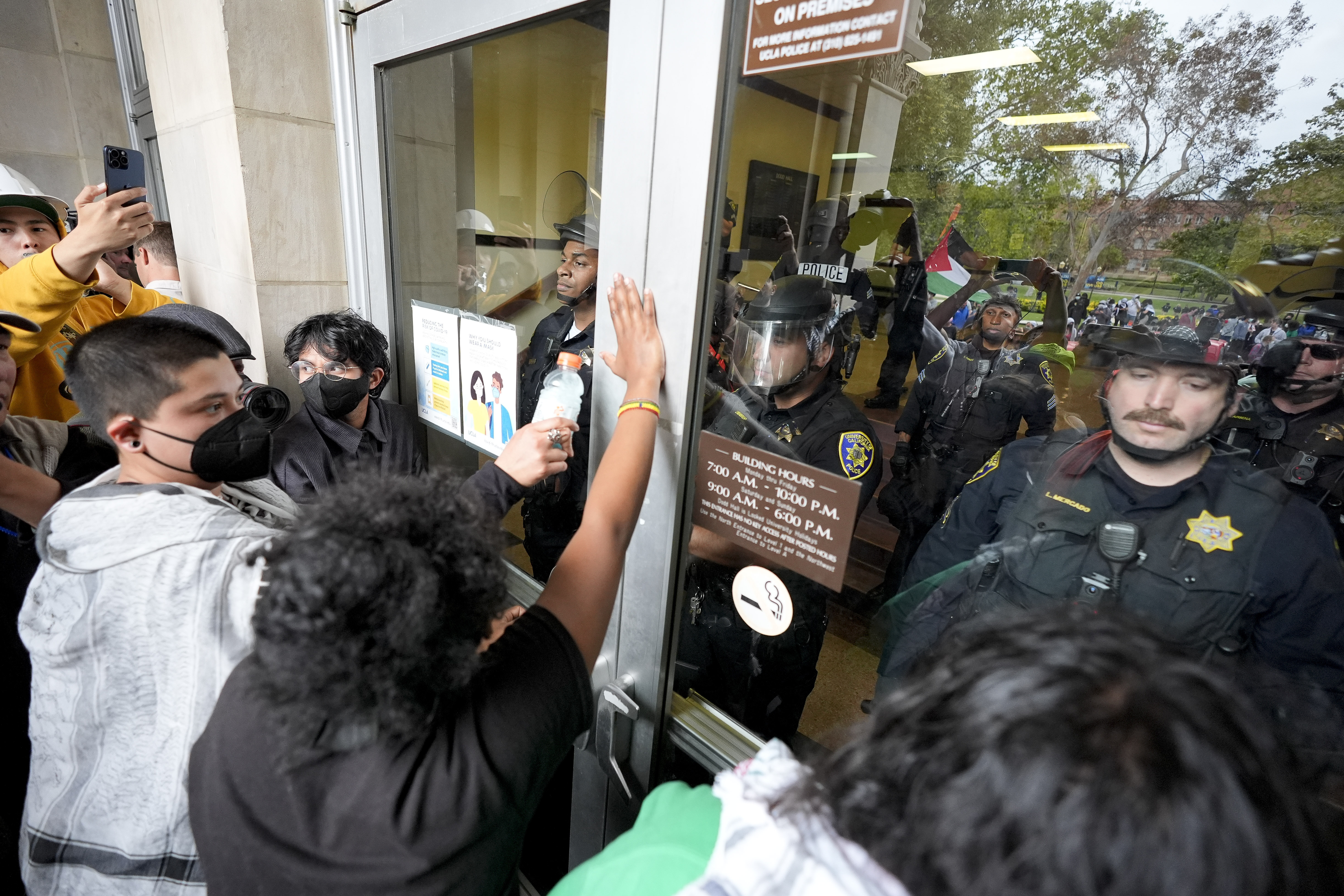 FILE - Police block pro-Palestinian demonstrators from entering a building on the UCLA campus, May 23, 2024, in Los Angeles. (AP Photo/Ryan Sun, File)