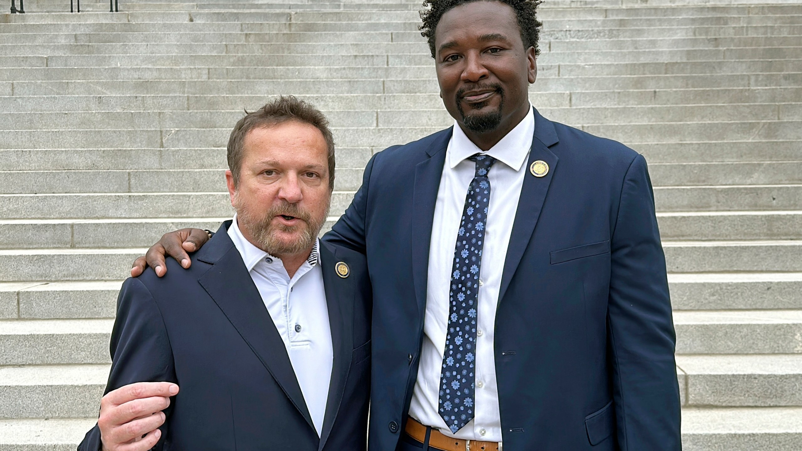 South Carolina state Reps. Brandon Cox, R-Goose Creek, left, and Jermaine Johnson, D-Columbia, right talk about their efforts to honor Robert Smalls, who will soon be the first African American individual with a statue at the South Carolina Statehouse, Friday, Sept. 13, 2024, in Columbia, S.C. (AP Photo/Jeffrey Collins)